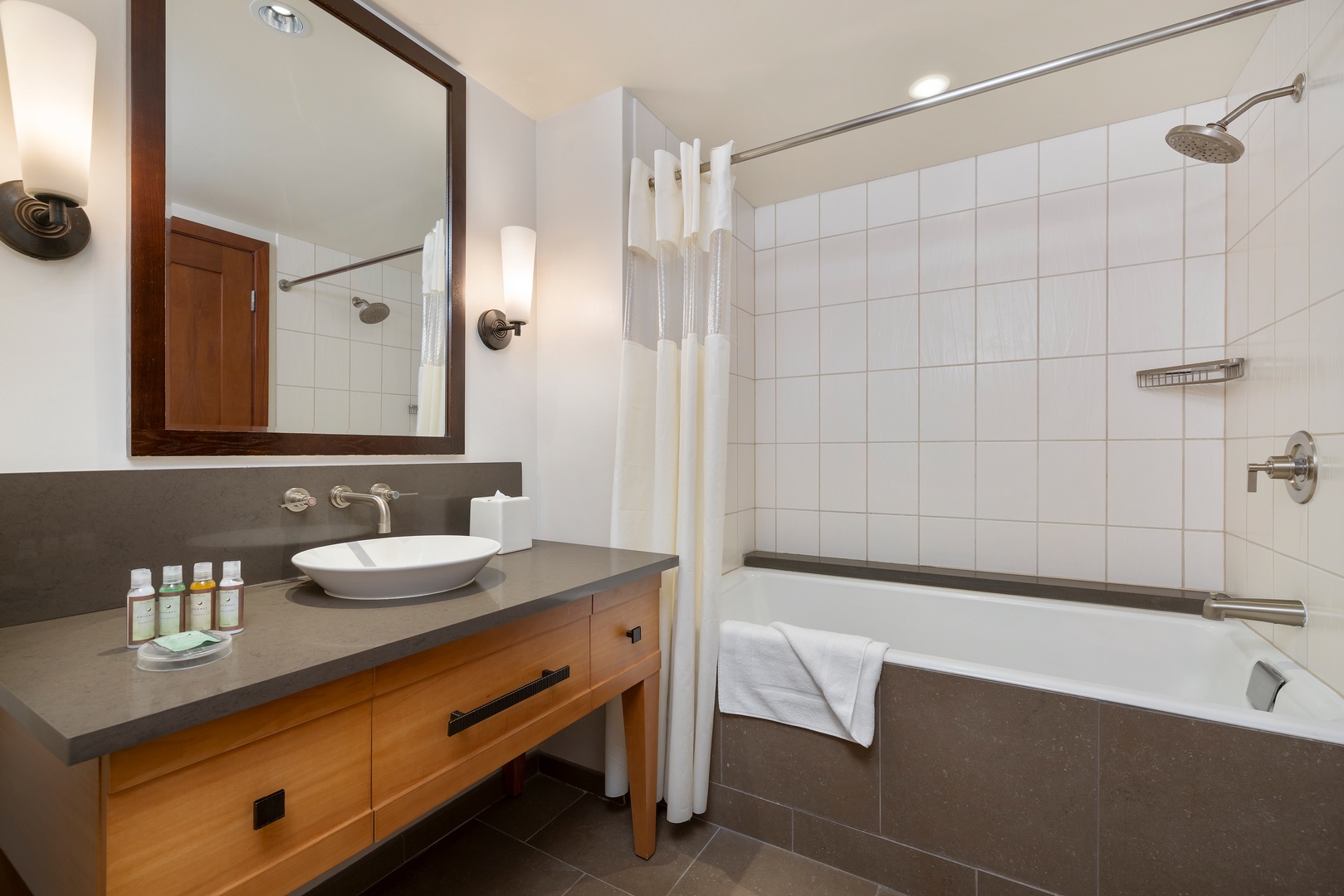 Kapolei Vacation Rentals, Ko Olina Beach Villas B506 - Unwind in your elegant bathroom featuring a deep soaking tub, rainfall shower, and premium amenities for ultimate relaxation.