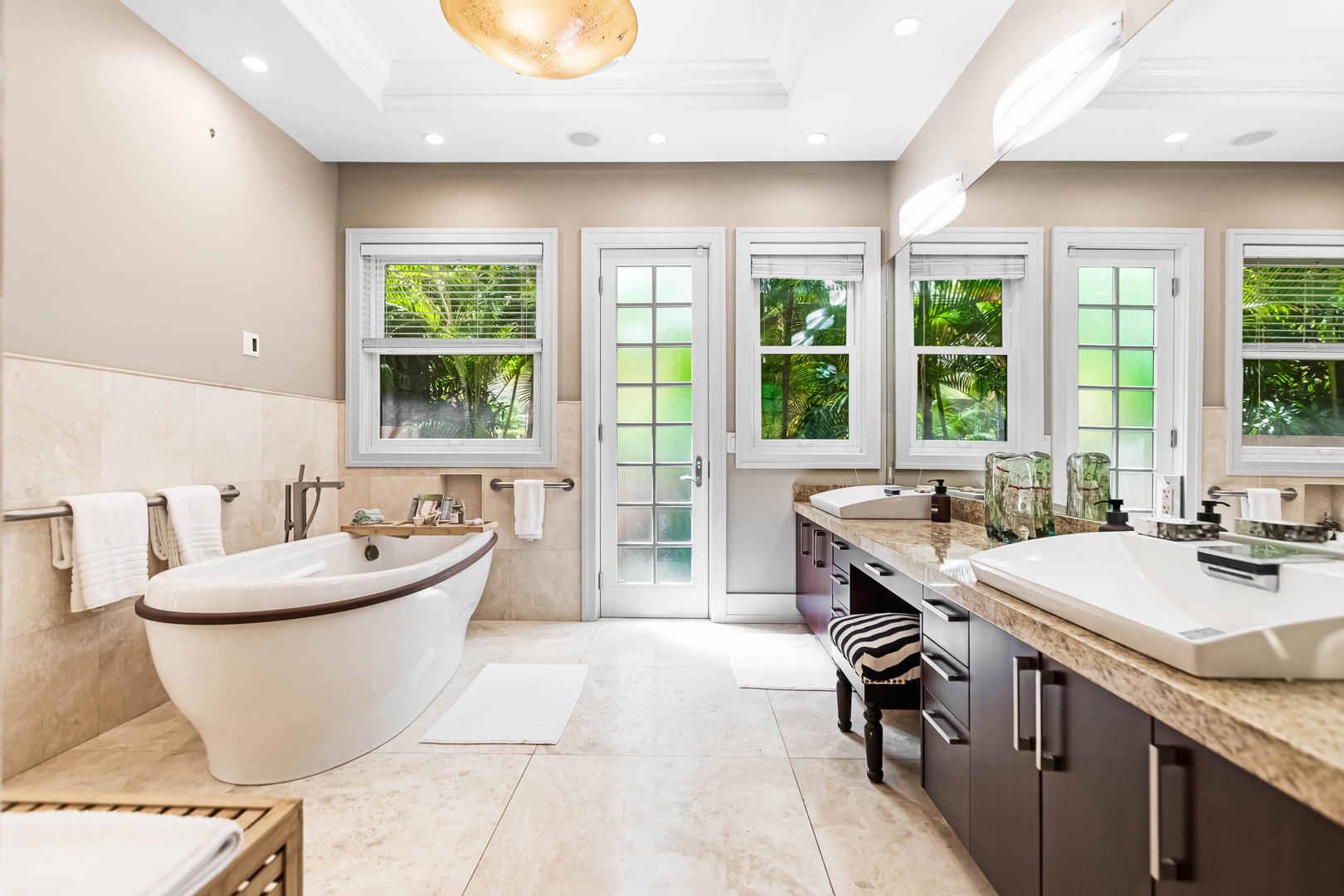 Honolulu Vacation Rentals, Pili Pono - Primary suite bathroom with soaking tub, dual vanities & lanai access.