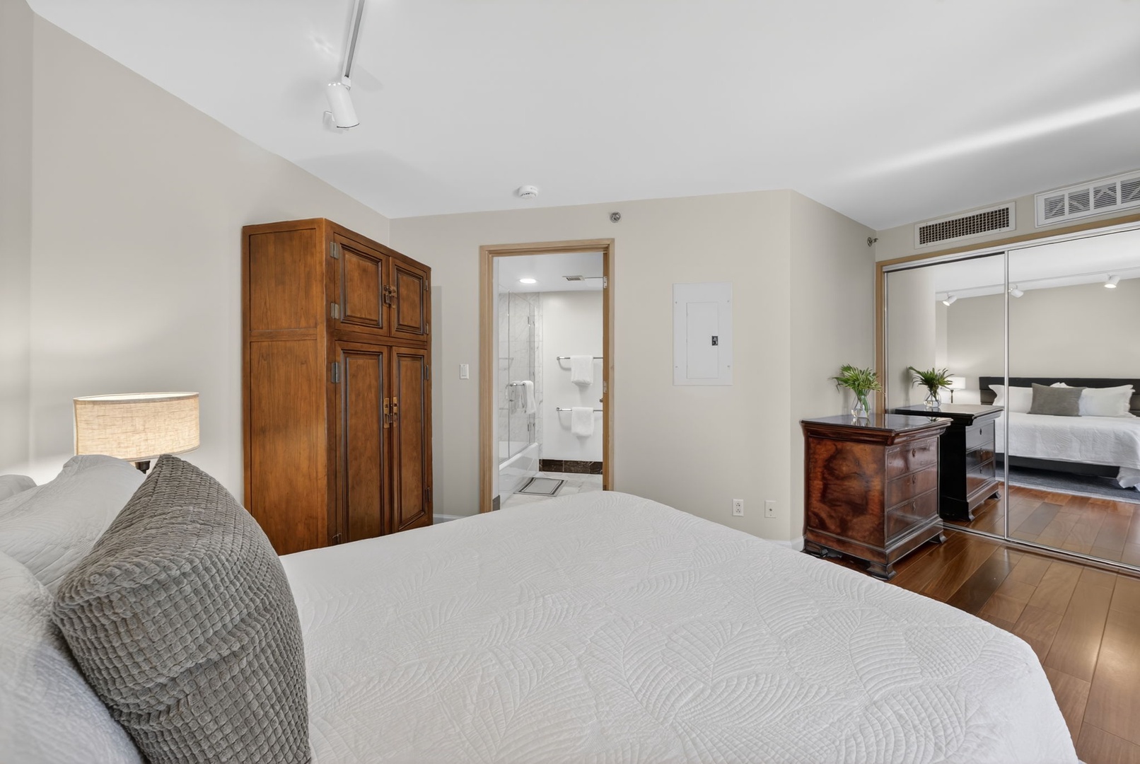 Honolulu Vacation Rentals, Island View at Waikiki Landmark - Recharge in this calming bedroom with rich wood furnishings and nearby ensuite access.