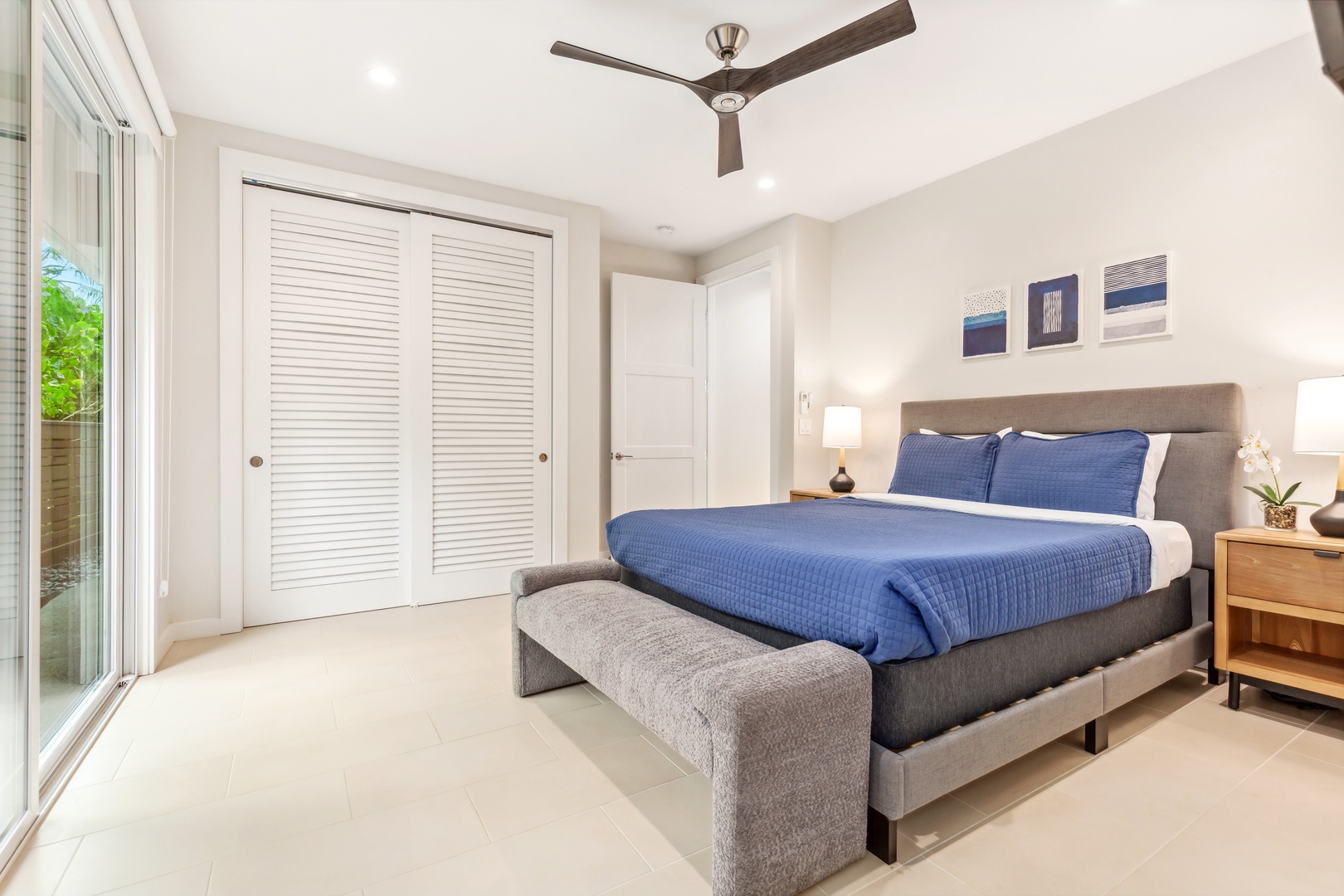 Laie Vacation Rentals, Majestic Mahakea Oceanfront Oasis - Third Guest bedroom with modern furnishings and direct access to a private outdoor area.