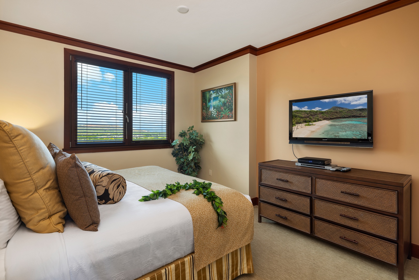 Kapolei Vacation Rentals, Ko Olina Beach Villas O1004 - The primary guest bedroom has a TV, natural lighting and plenty of storage.