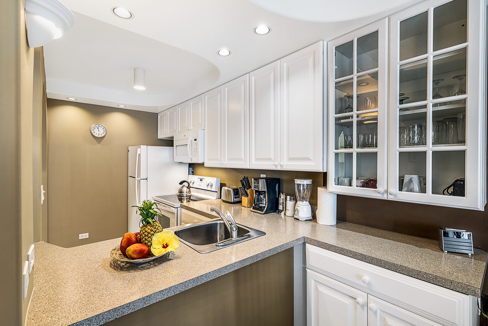 Kailua Kona Vacation Rentals, Kona Alii 304 - The kitchen at Kona Alii 304 is outfitted with all large appliances, a variety of small ones, as well as all culinary essentials needed to create a savory gourmet meal