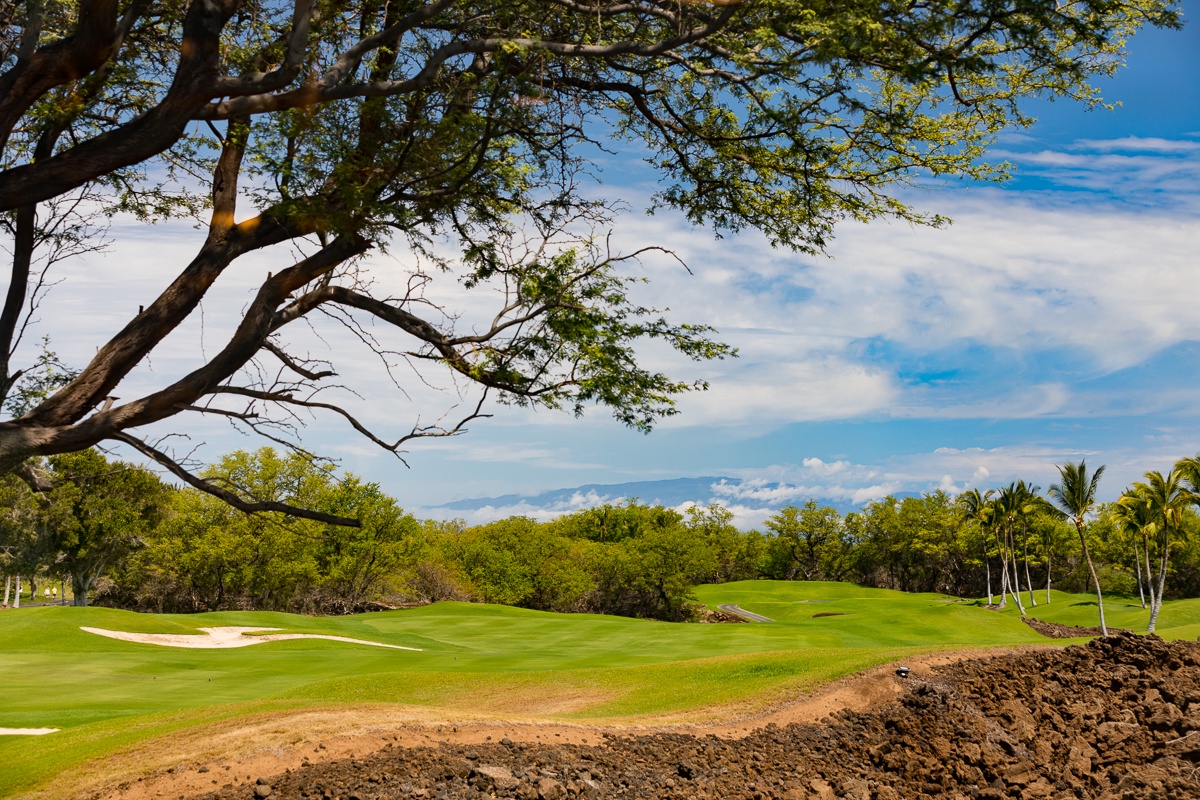 Kamuela Vacation Rentals, Mauna Lani KaMilo #123 - Main Lanai sweeping view of the Mauna Lani North Course 11th fairway and, on clear days, you can take in the vista of Maui in all her glory.