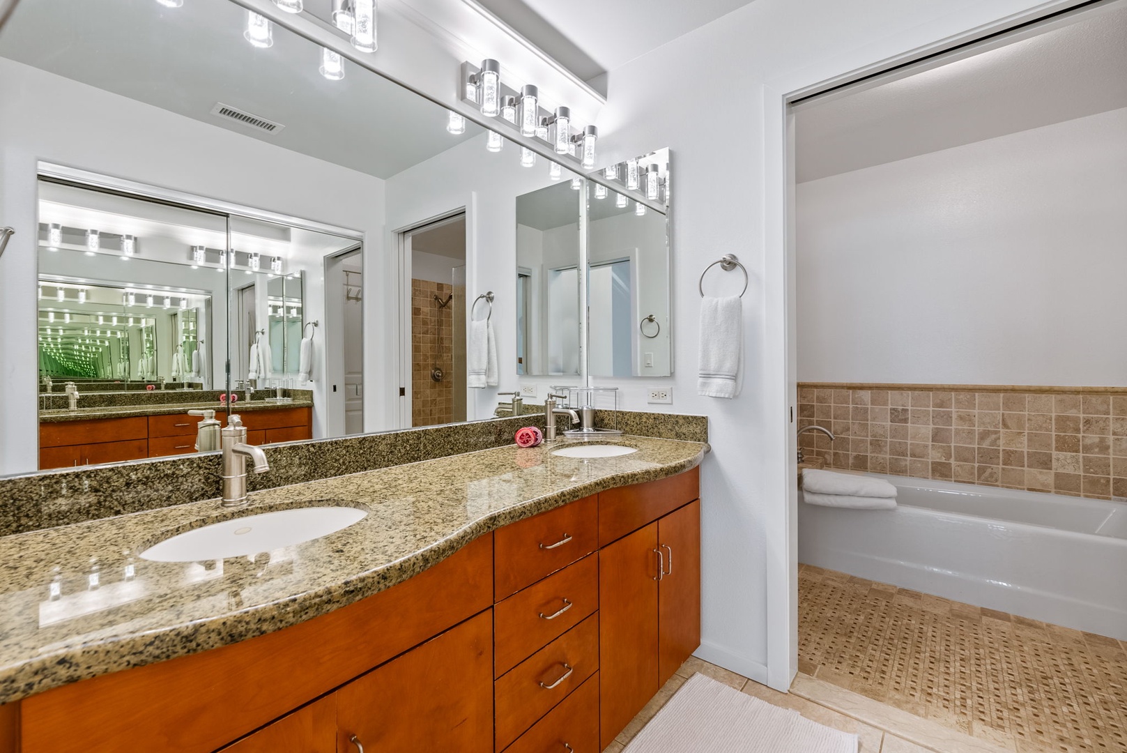 Kapolei Vacation Rentals, Kai Lani Luxury 6D - The ensuite bathroom with a double-sink granite vanity, large mirrors, and ample lighting for your daily routine.