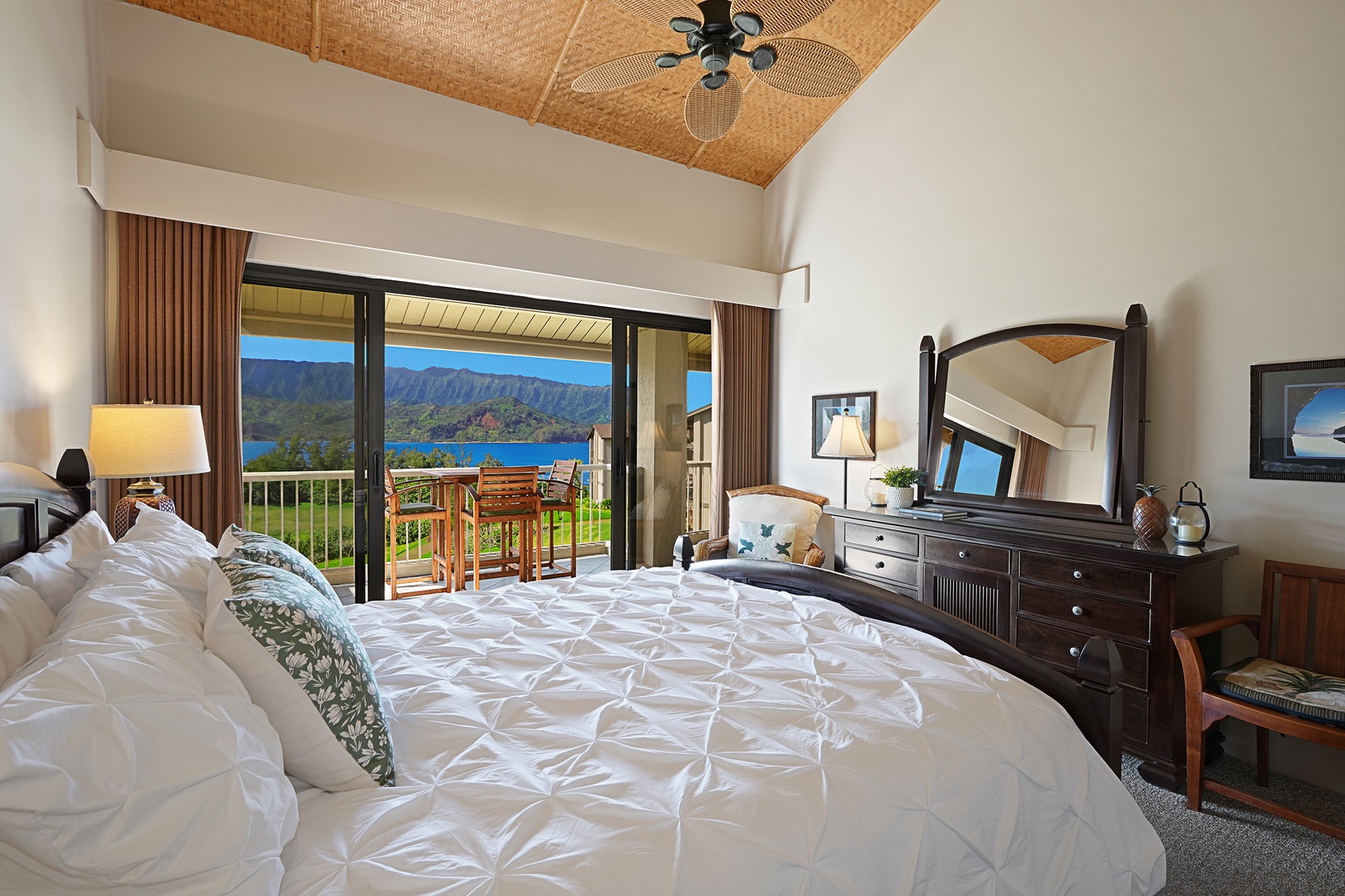 Princeville Vacation Rentals, Hanalei Bay Resort 4301/2/3 - Cozy bedroom one with direct lanai access and a plush bed overlooking scenic vistas. – Drift off to sleep while enjoying the views.