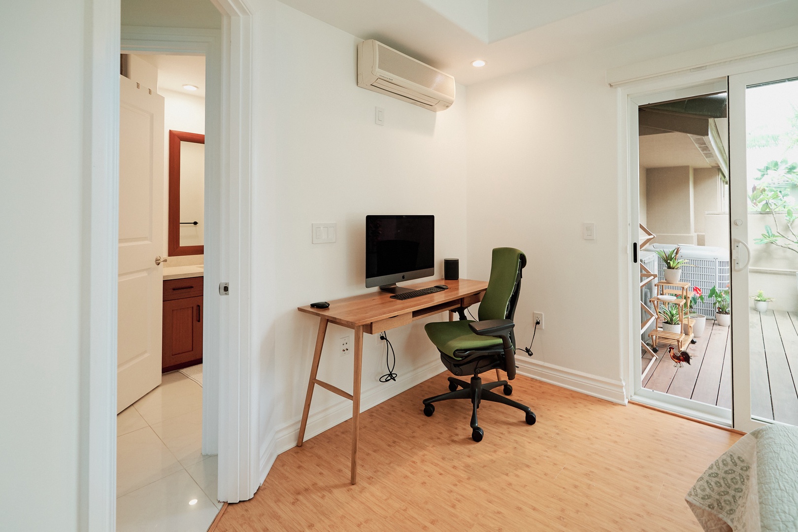 Princeville Vacation Rentals, Hale Kai - Your dedicated workspace features a sleek wooden desk, ergonomic chair, and computer setup with climate control to keep you comfortable during productive sessions.