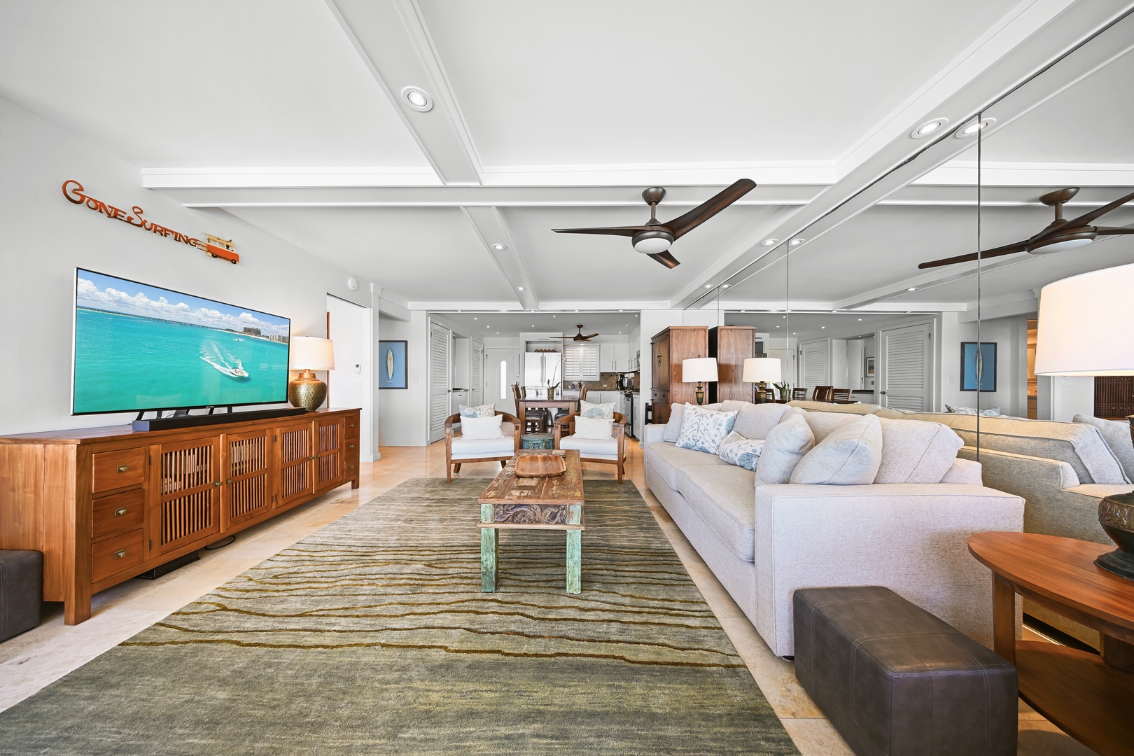 Honolulu Vacation Rentals, Kaimana Shores Getaway - The spacious open layout connects the living room, dining area, and kitchen, creating an airy space for extended island stays.