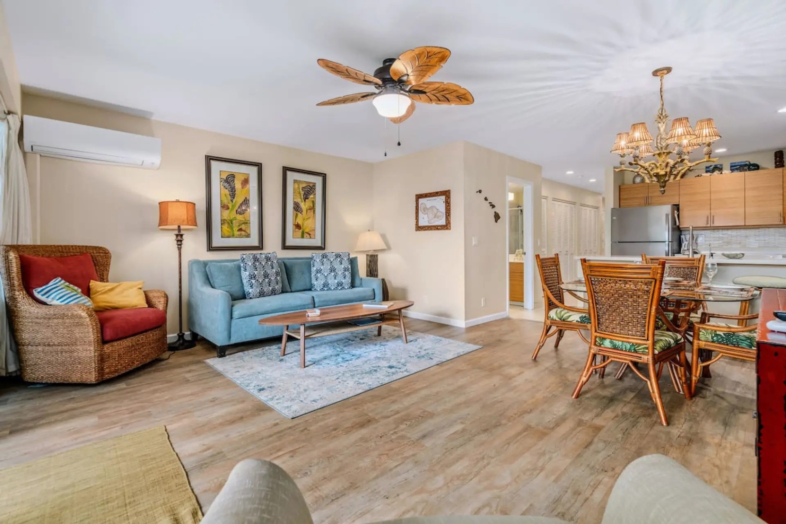 Kihei Vacation Rentals, Maui Kamaole E103 - An open floor plan lets the whole group spread between the sofa, the table, and the kitchen.