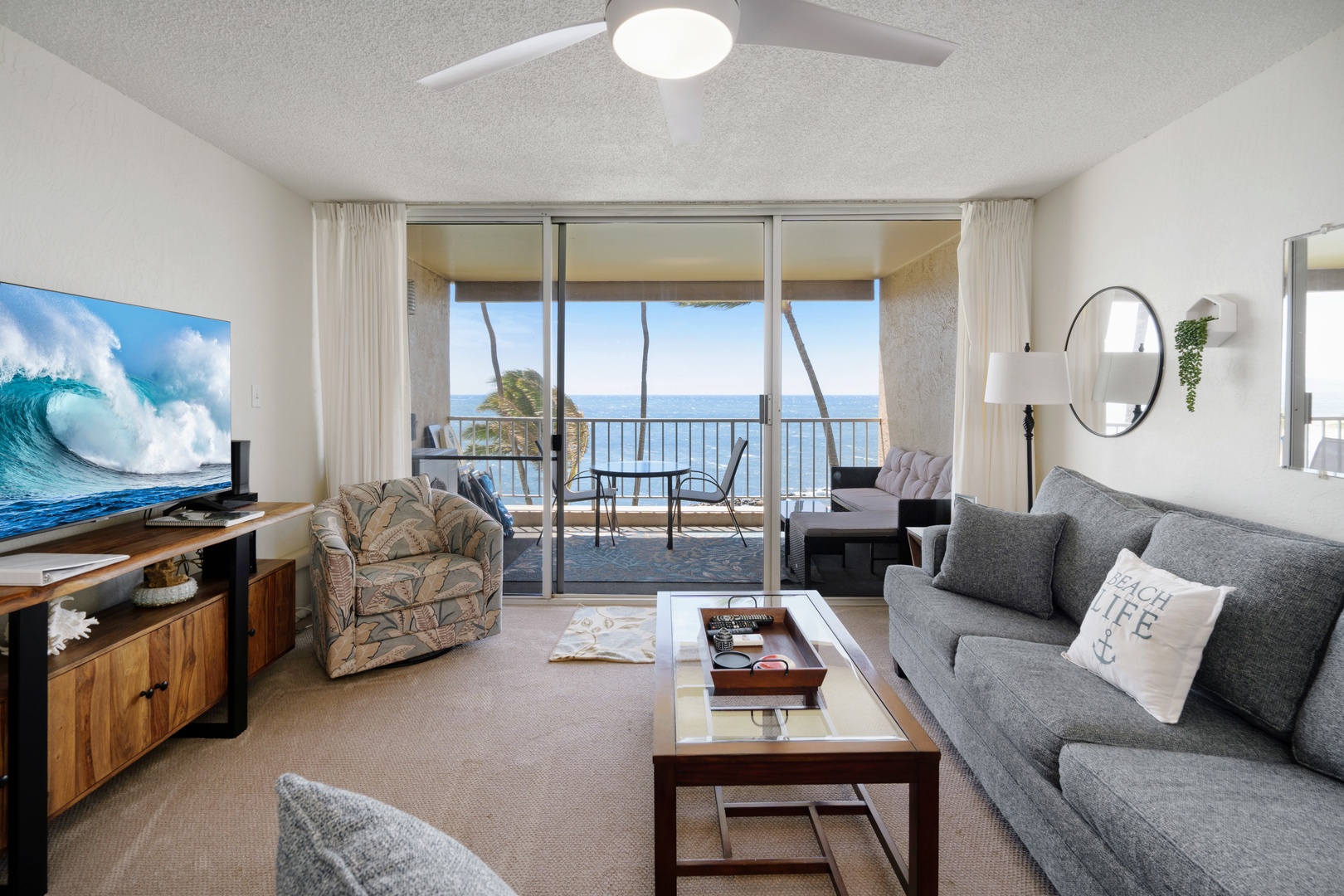 Kihei Vacation Rentals, Menehune Shores 316 - The swivel chair angles straight toward the water, no scrolling required to find the view.