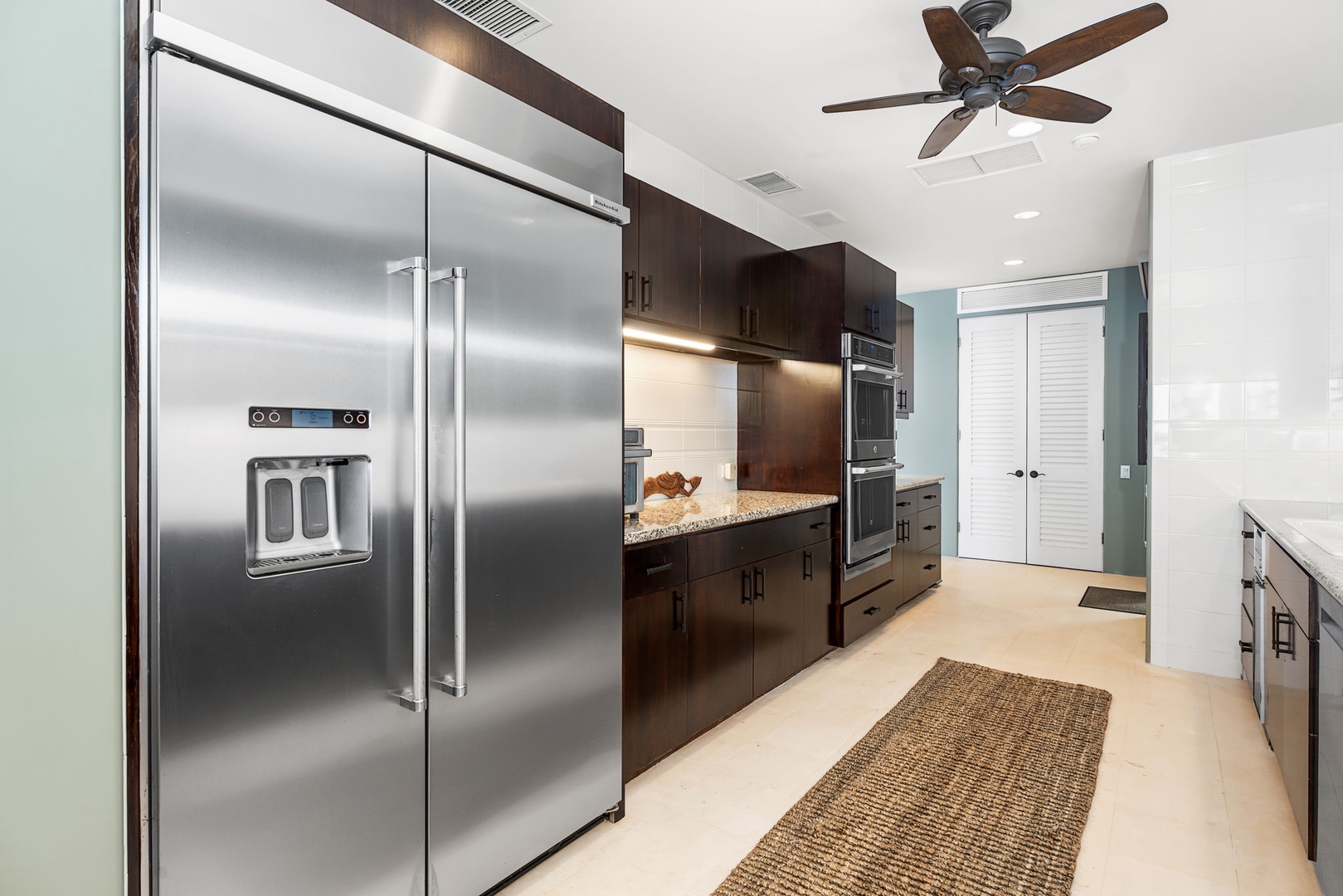 Kailua Kona Vacation Rentals, Hale Nai'a - The fully equipped gourmet kitchen features sleek stainless steel appliances and rich dark cabinetry, perfect for creating memorable meals.
