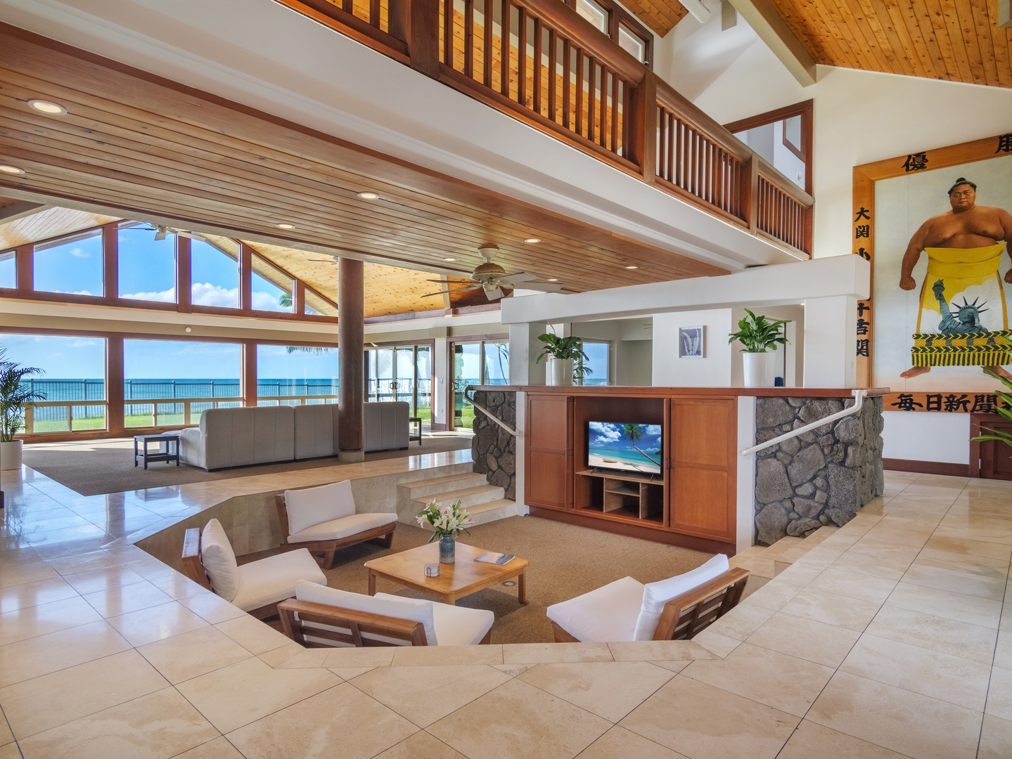 Waianae Vacation Rentals, Konishiki Beachhouse - Cozy sunken living space with wood accents and modern amenities for family entertainment.