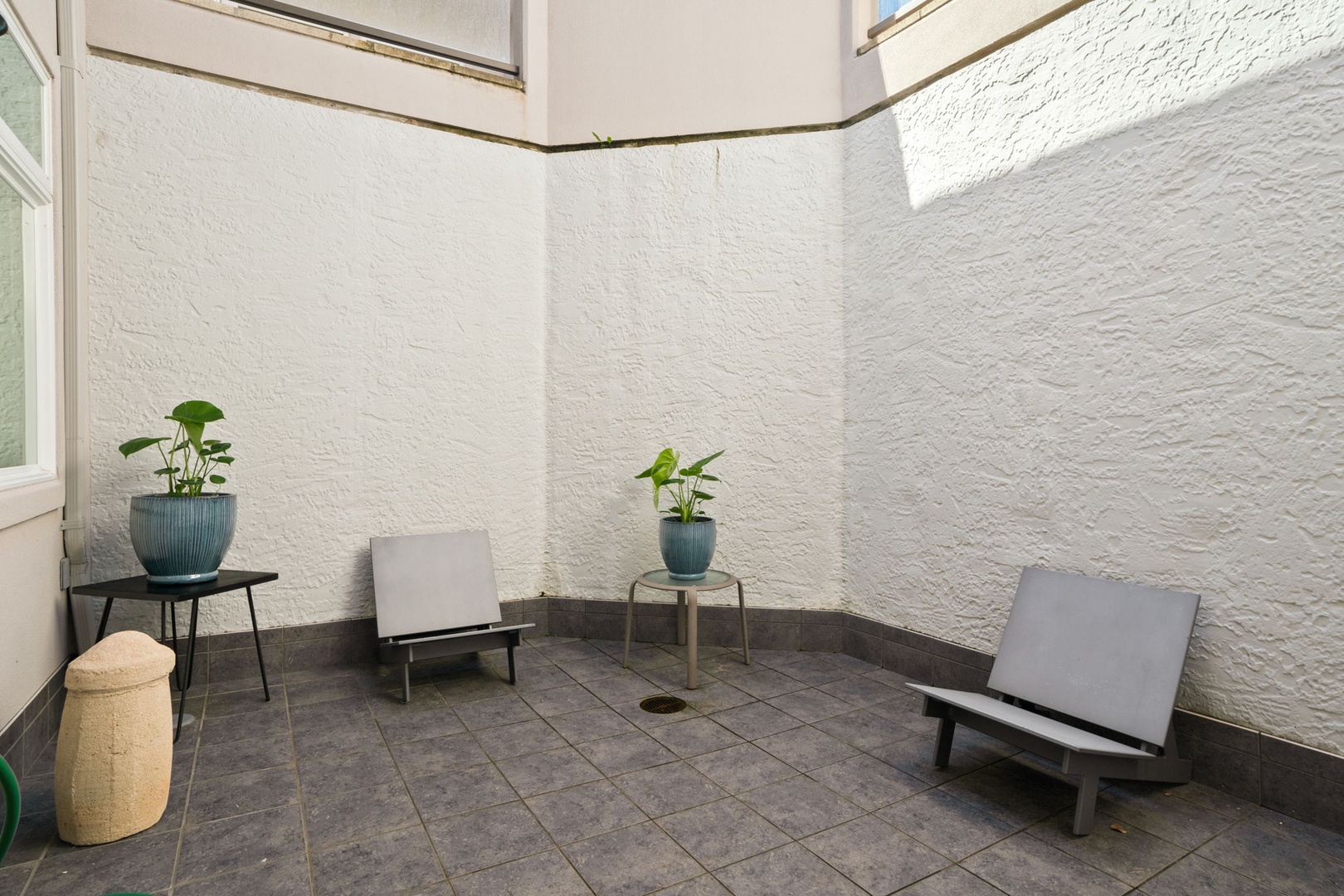 Princeville Vacation Rentals, Kaiulani #8 - Take your book out to the walled courtyard, open to the sky and all your own.