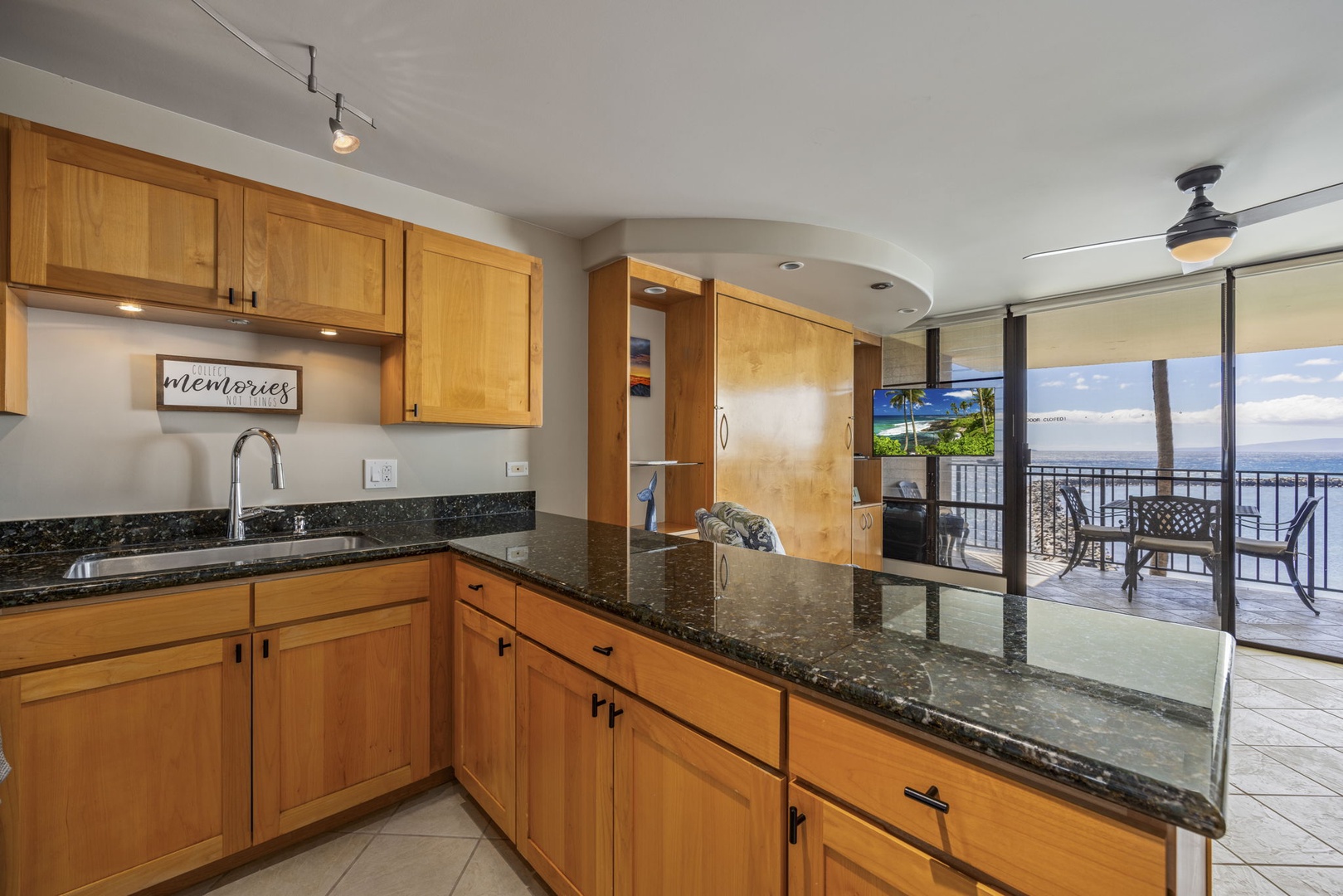 Wailuku Vacation Rentals, Milowai 310 - Stir dinner at the counter and the ocean is still right there through the sliding door.