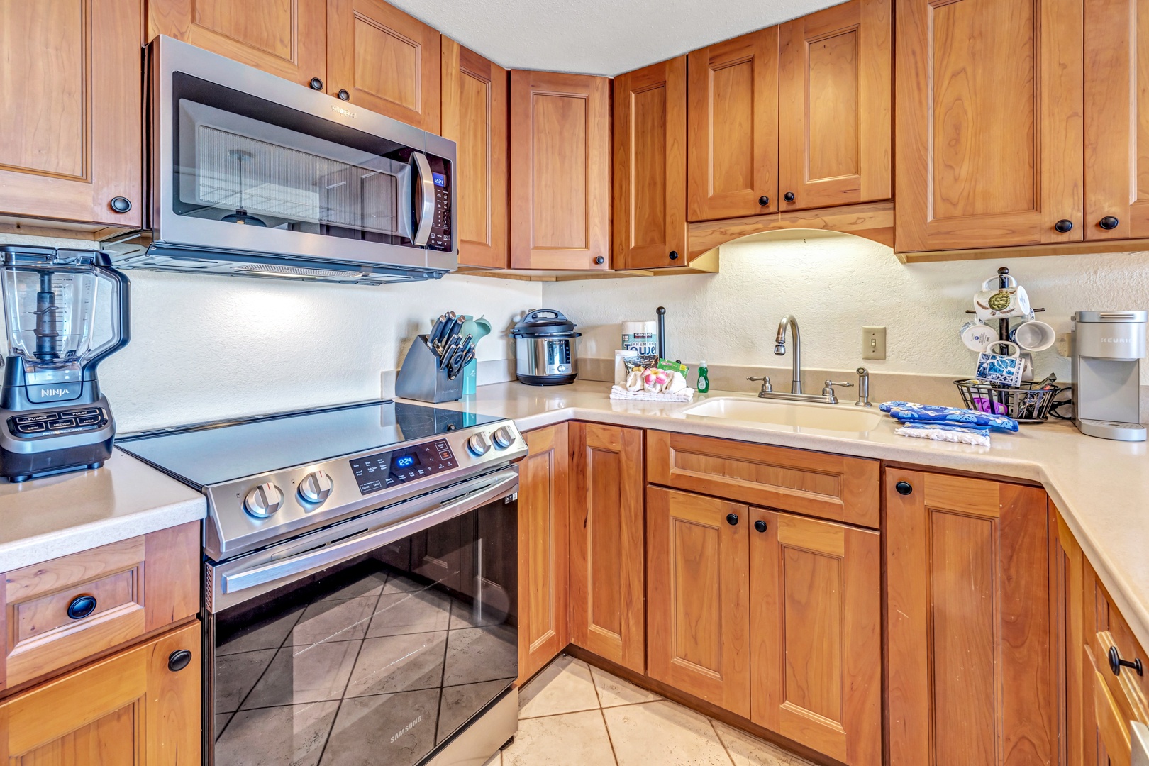 Lahaina Vacation Rentals, Kaanapali Shores 746 - The kitchen at Kaanapali Shores 746 features modern appliances and a functional layout.