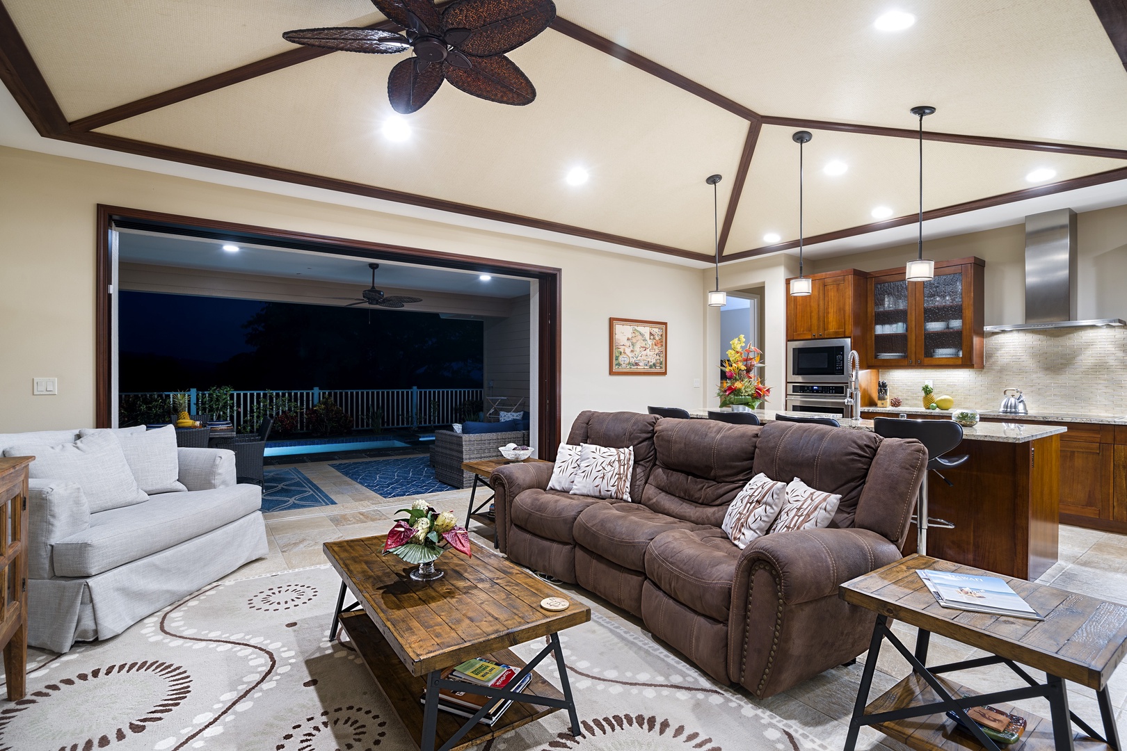 Kailua Kona Vacation Rentals, Kona Blue Vacations Holua Kai - Twilight in the great room—recline, relax, and reconnect in the island’s golden hour glow.