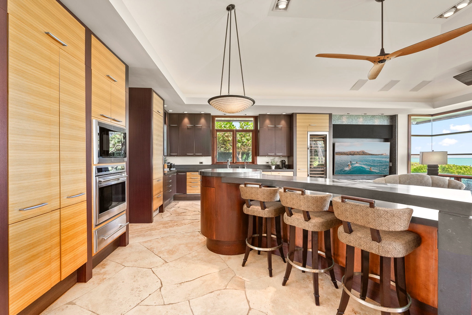 Kailua Vacation Rentals, Kailua Sands - Kitchen with breakfast bar and stainless appliances.