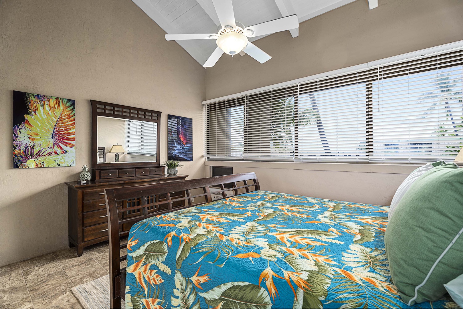Kailua Kona Vacation Rentals, Kona Makai 6303 - The Primary Bedroom has a king-sized bed, a large dresser and a large window allows you to awake to ocean views and fresh tropical breezes every morning.
