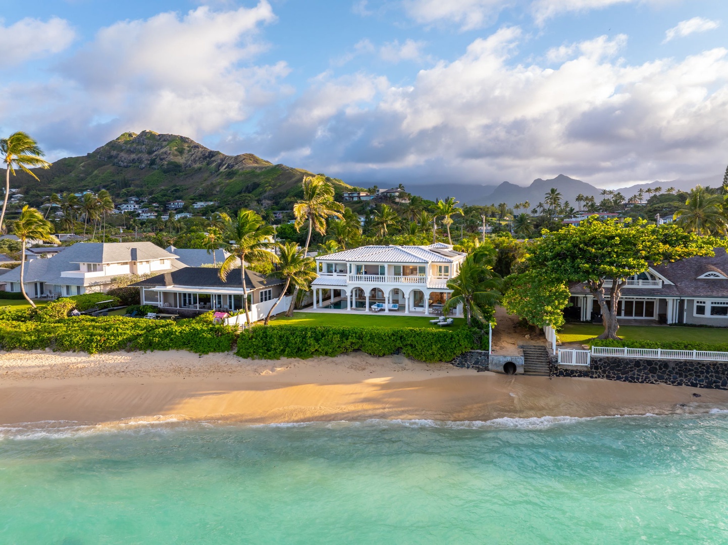 Kailua Vacation Rentals, Lanikai Sunrise Estate - Sunrise illuminates the estate’s beachfront elegance and palm-lined architecture.