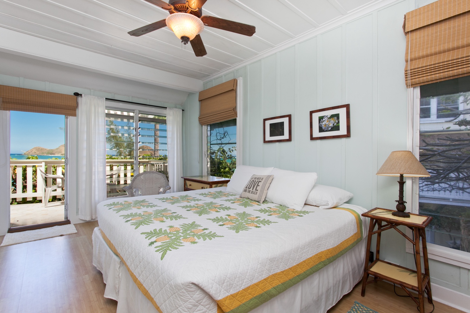 Kailua Vacation Rentals, Lanikai Village* - Hale Kainalu: Guest bedroom with a king bed, double futon and access to the lanai.