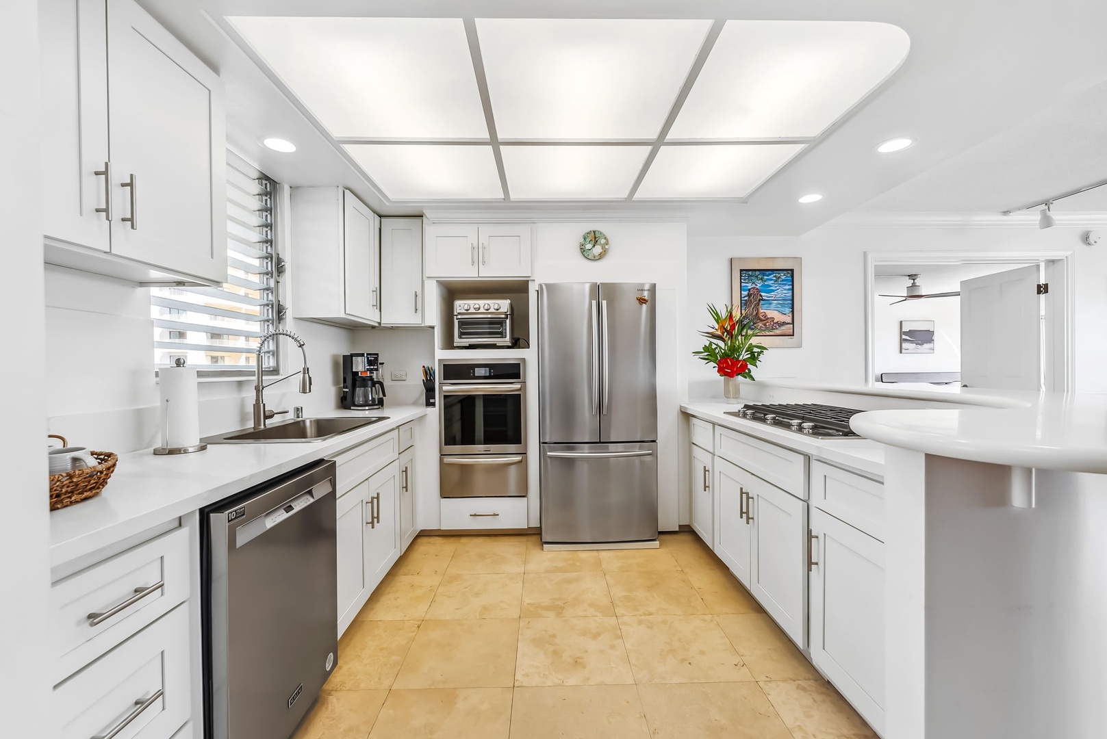 Honolulu Vacation Rentals, Colony Surf Getaway - Contemporary kitchen equipped with top-of-the-line appliances for a seamless cooking experience.