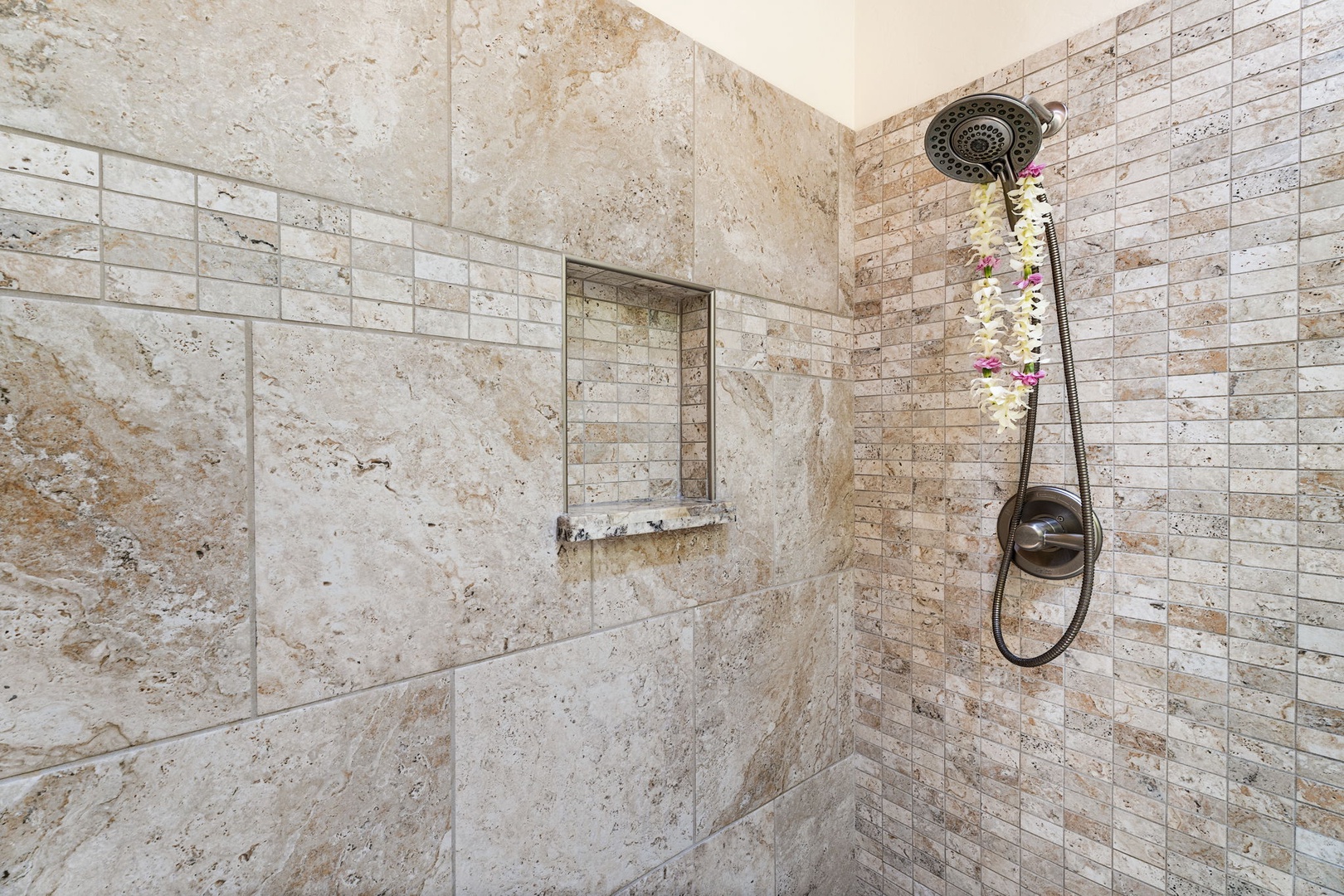 Kailua Kona Vacation Rentals, Kanaloa at Kona 1606 - A walk-in shower wrapped in stone tile, bench and all.