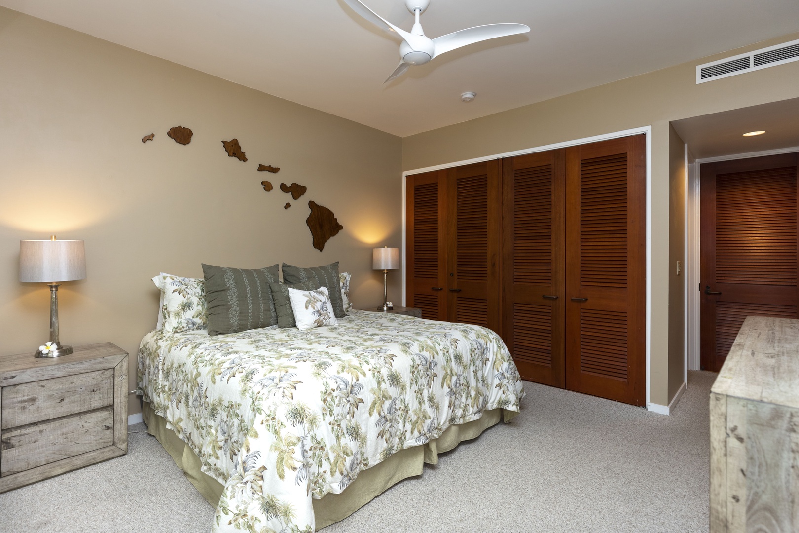 Kamuela Vacation Rentals, Mauna Lani Point E105 - The guest suite features a plush king bed and ample space for added comfort.