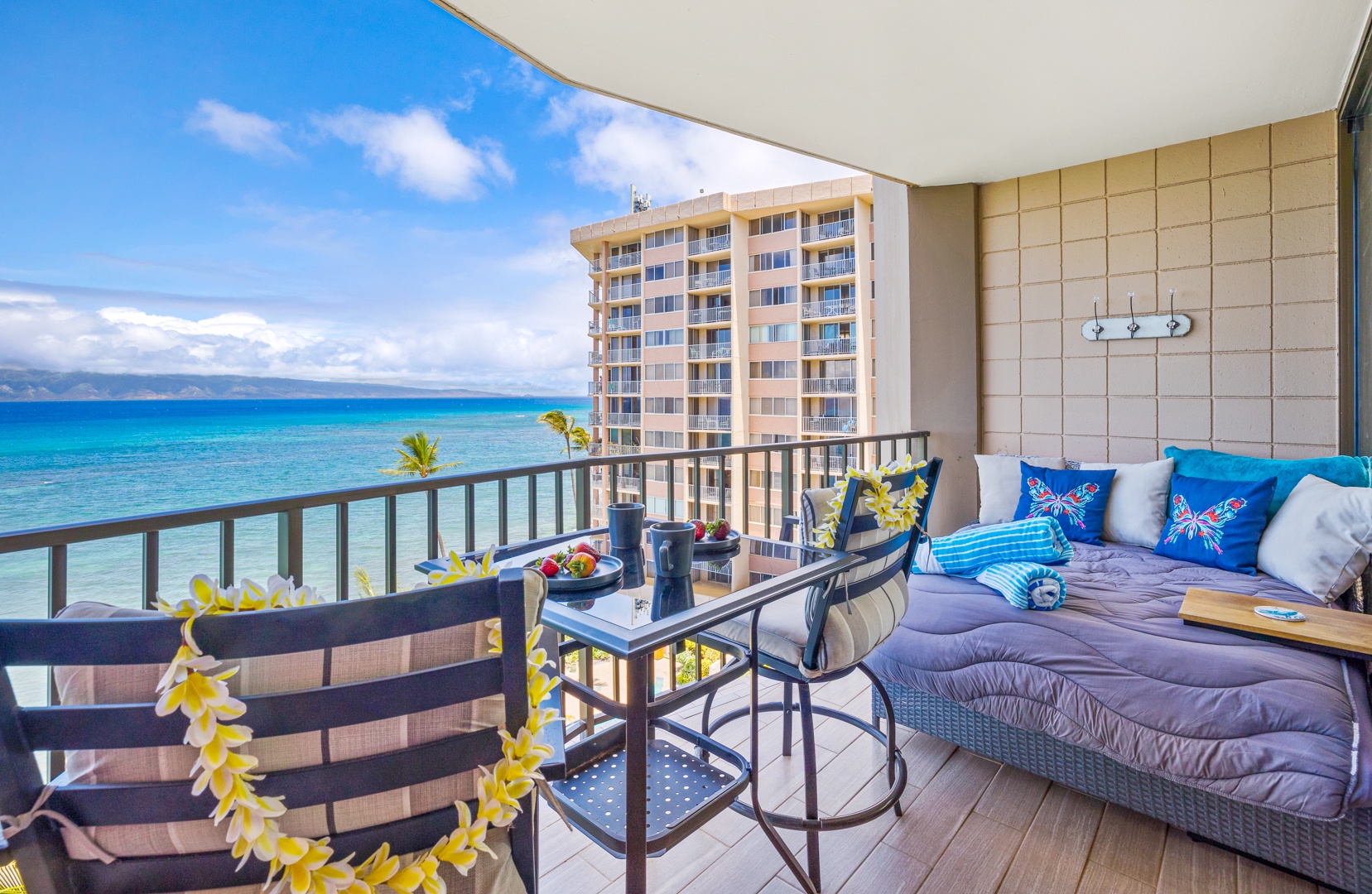 Lahaina Vacation Rentals, Valley Isle 804 - Take in the ocean breeze and sweeping views from this cozy lanai. Perfect for enjoying your morning coffee or unwinding with a drink in the evening