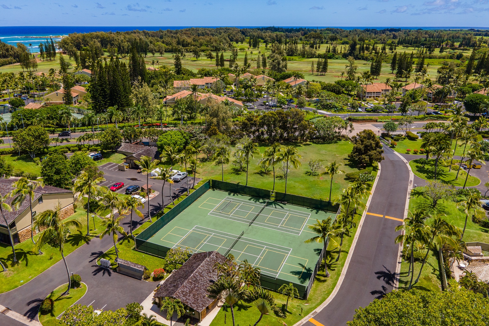 Kahuku Vacation Rentals, Pulelehua Kuilima Estates West #142 - Aerial shot of the community tennis court.