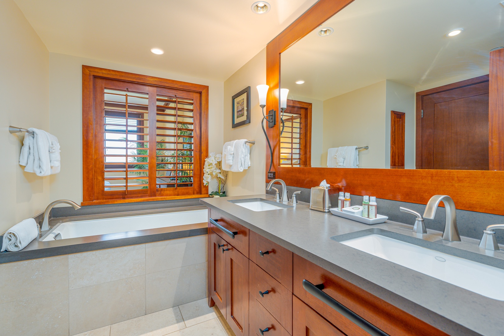 Kapolei Vacation Rentals, Ko Olina Beach Villas O904 - The primary guest bathroom with a double vanity and large soaking tub.