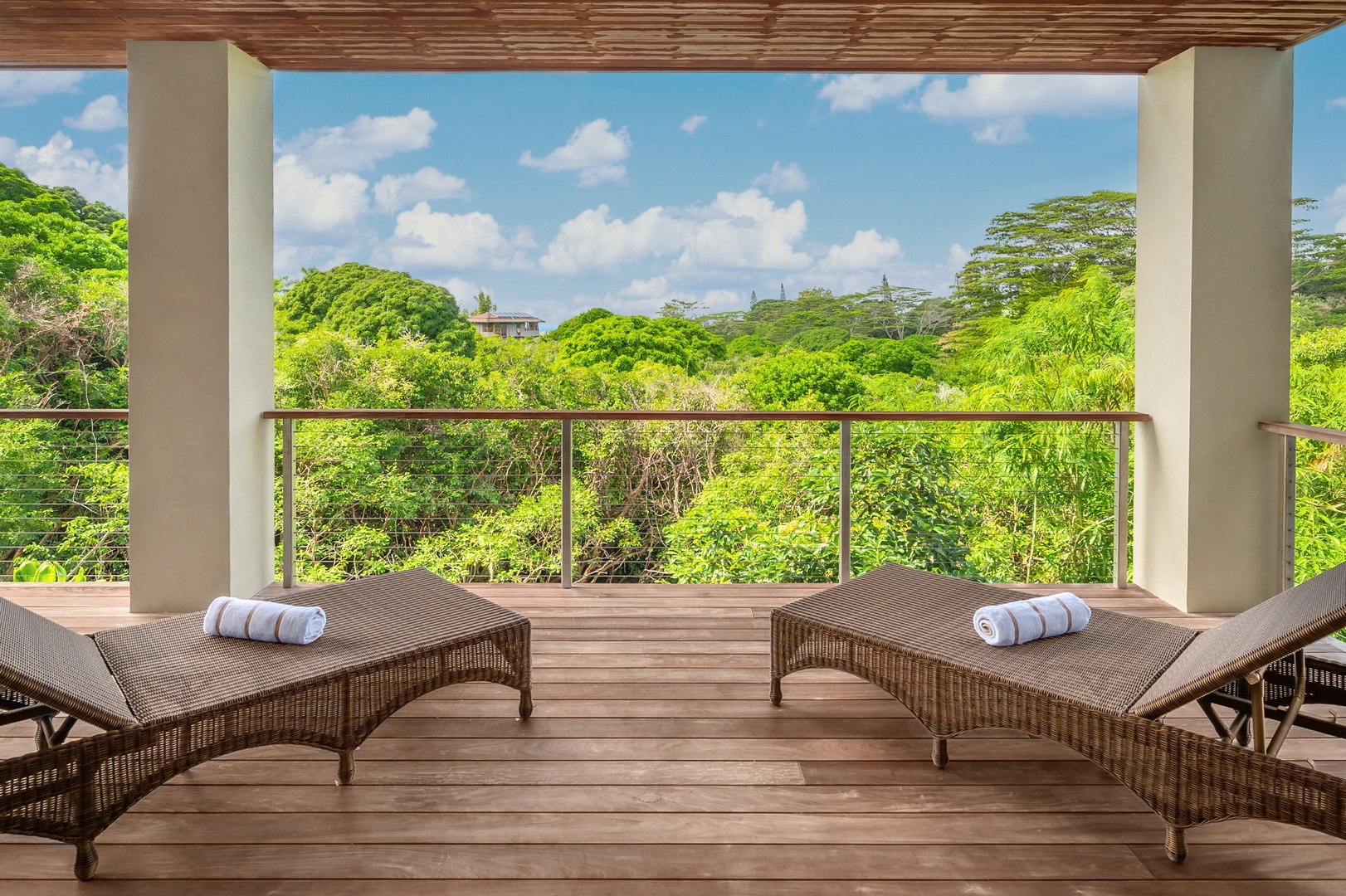 Princeville Vacation Rentals, Hanalei Plantation Villa - Private balcony with loungers overlooking lush surroundings, ideal for enjoying the tranquil setting.