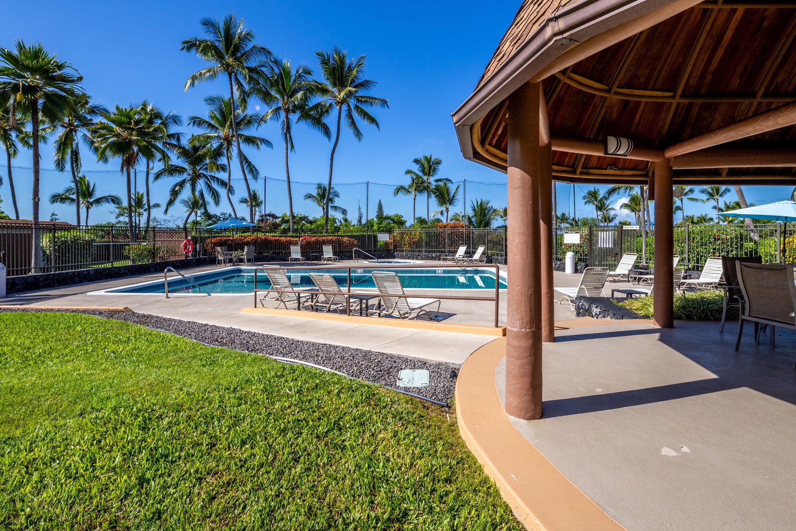 Kailua Kona Vacation Rentals, Keauhou Kai C301 - Loungers on the deck and grass at the edge, room to spread the group out.