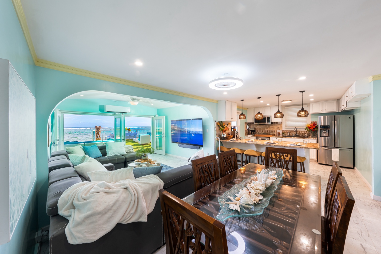 Hauula Vacation Rentals, Private Beach Paradise - Light-filled living and dining space framed by sweeping ocean views.
