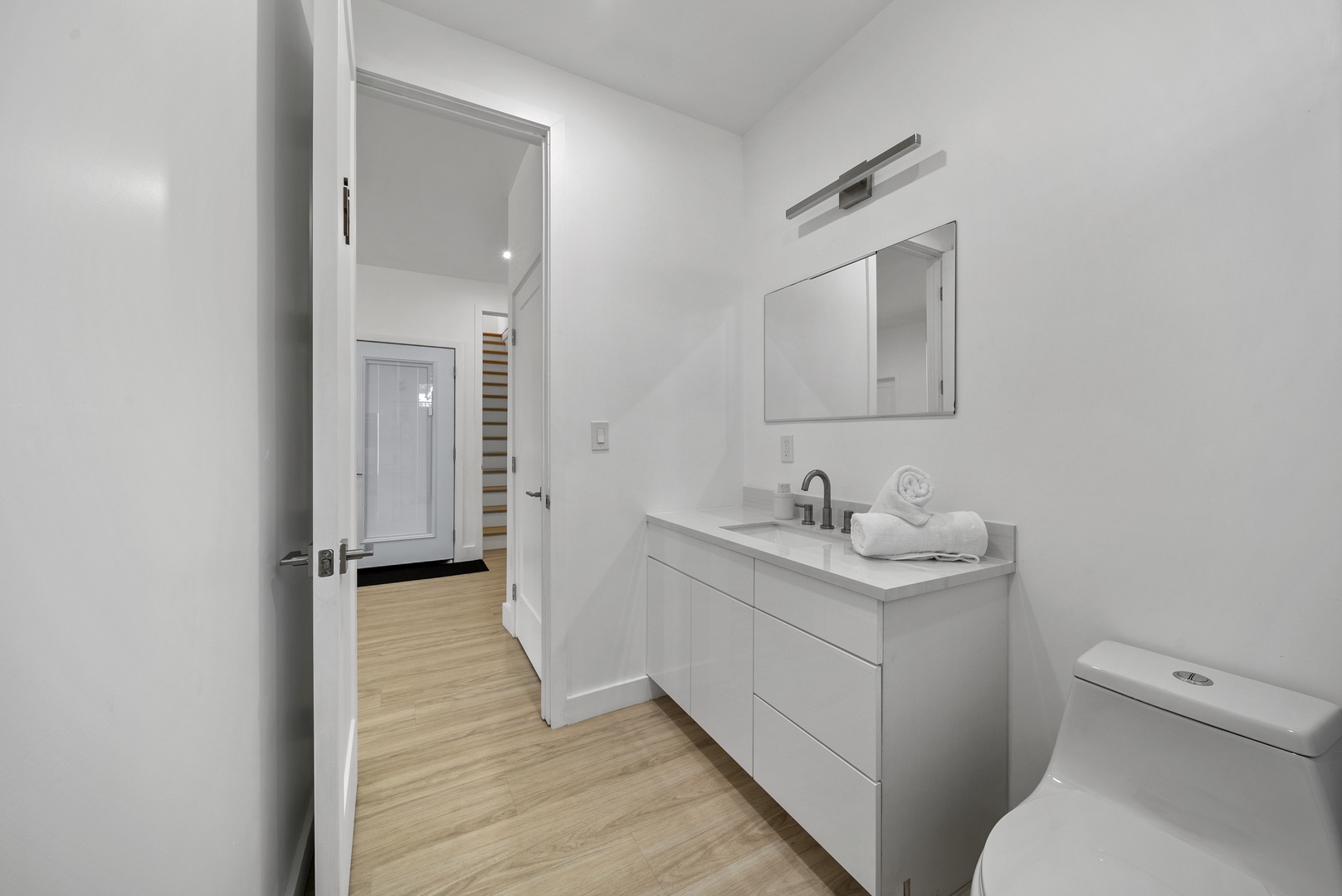 Haleiwa Vacation Rentals, Sunset Beach Island Retreat - Downstairs bathroom with its clean lines and white cabinetry