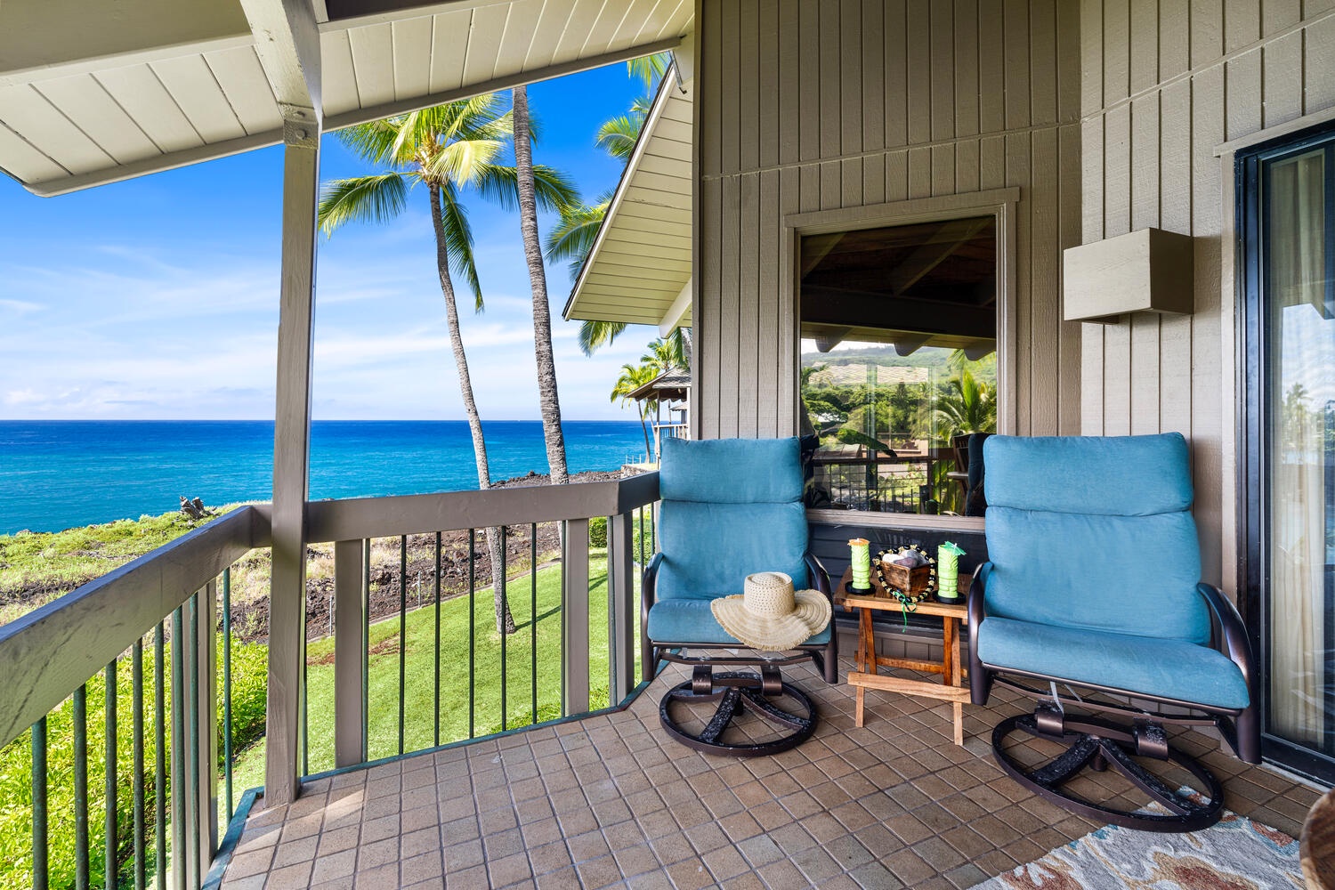 Kailua Kona Vacation Rentals, Kanaloa at Kona 3304 - Covered lanai with lounge seating and panoramic views of Heeia Bay.