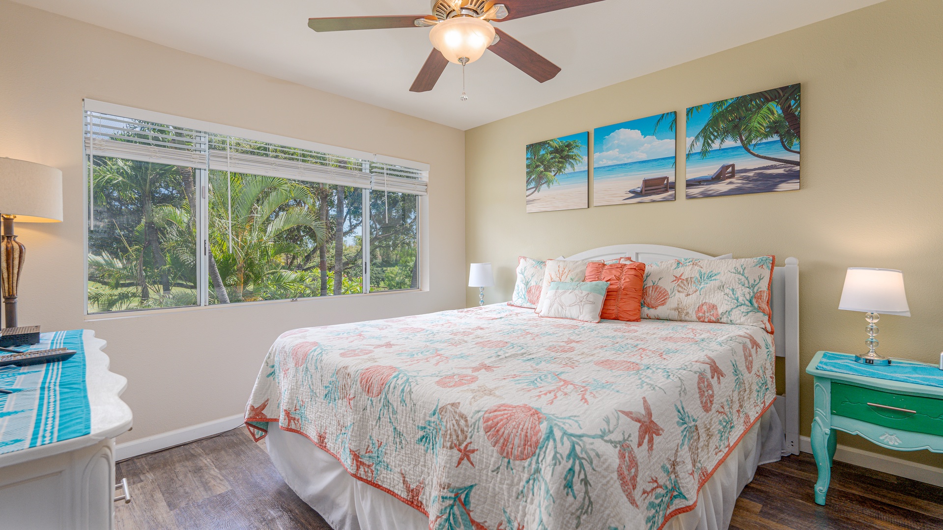Kapolei Vacation Rentals, Fairways at Ko Olina 8G - Drift off in your tropical paradise bedroom with ocean-themed decor and lush garden views through the window.