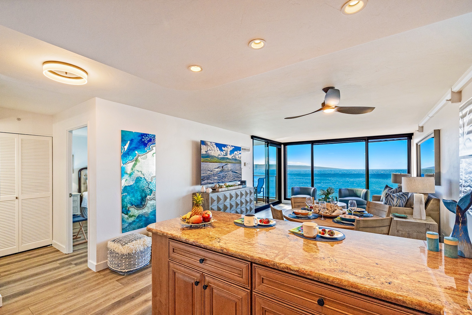 Lahaina Vacation Rentals, Mahana 1118 - This inviting open-concept space blends the kitchen and living areas seamlessly, offering a bright, airy ambiance and uninterrupted ocean views