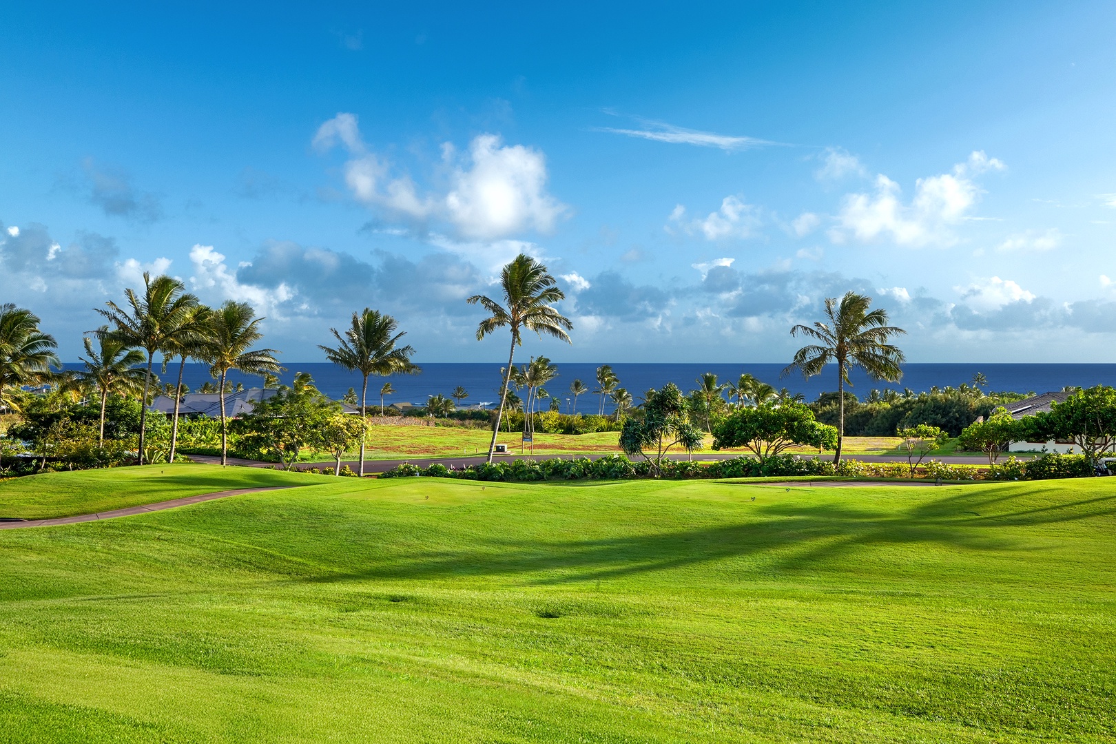 Koloa Vacation Rentals, Hiki Moe Hale - Stunning lanai view overlooking a lush green golf course and the ocean.