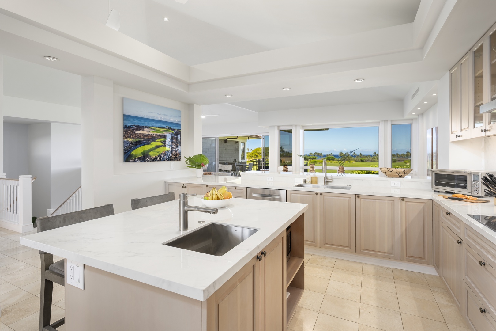 Kailua Kona Vacation Rentals, 3BD Palm Villa (130B) at Hualalai Resort - Your spacious kitchen features modern appliances and stunning views through large windows, creating the perfect space for culinary adventures.