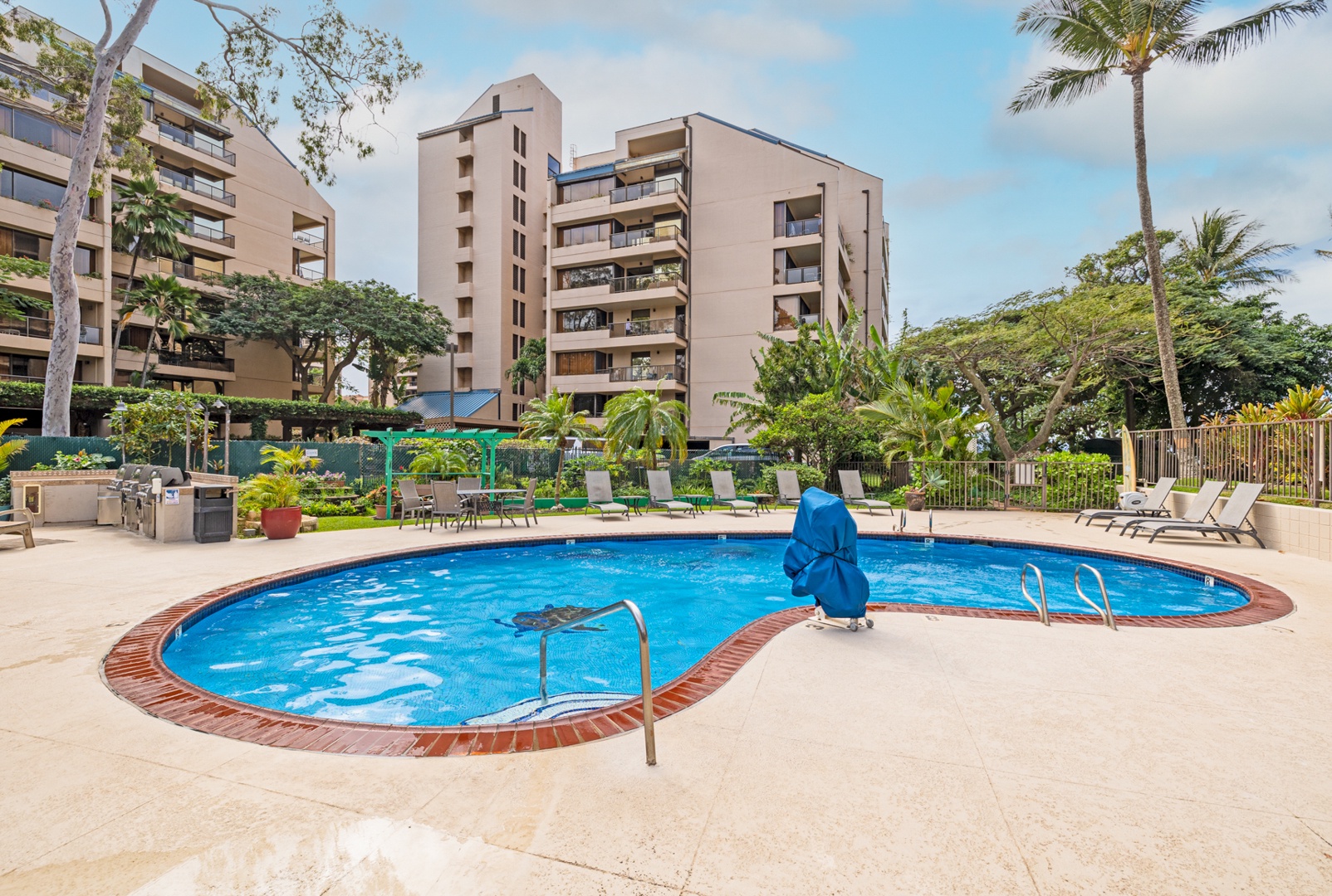 Lahaina Vacation Rentals, Valley Isle 804 - Relax by the pool surrounded by lush tropical gardens, offering a peaceful retreat just steps away from your vacation rental.