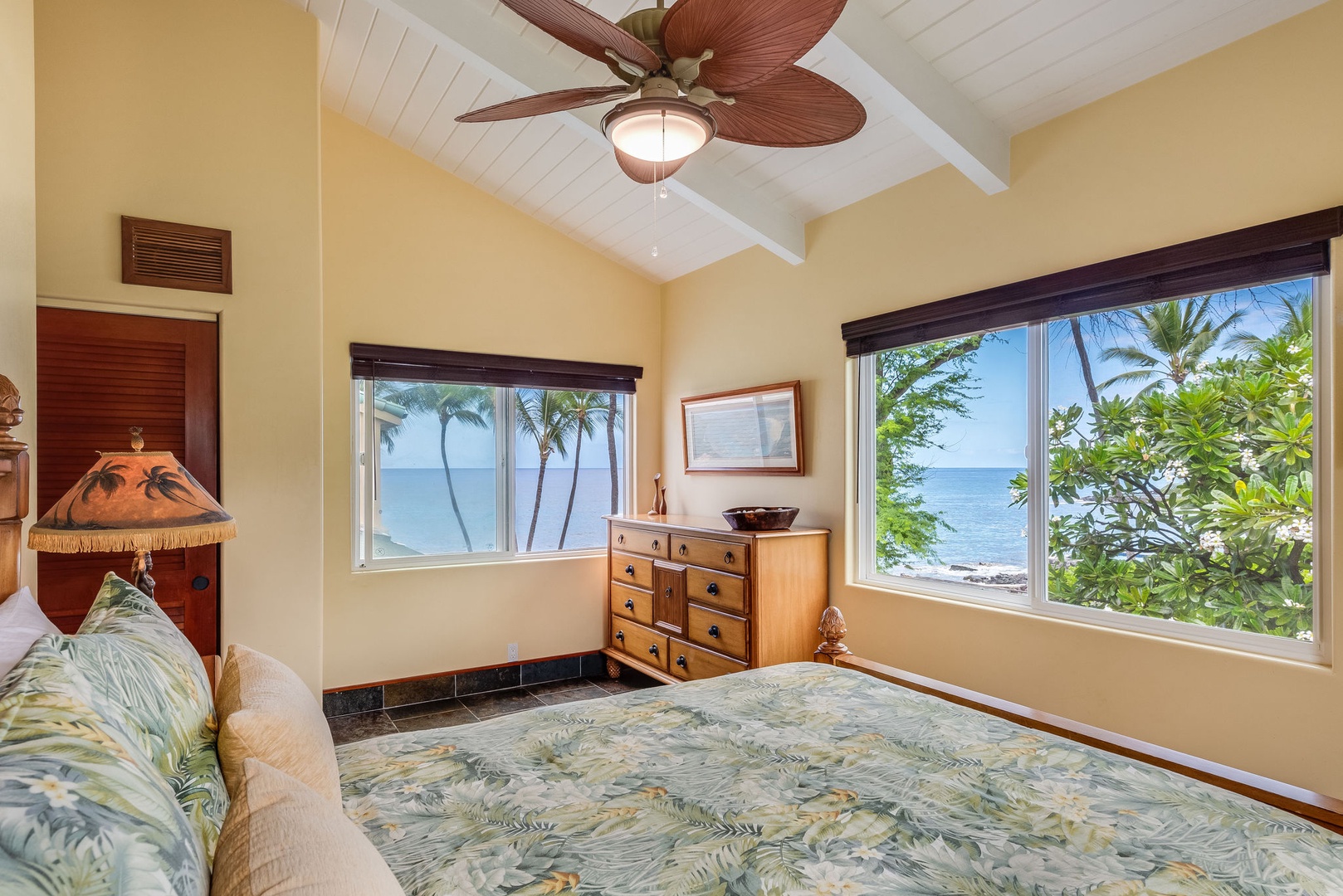 Kailua Kona Vacation Rentals, Kona Beach Bungalows** - Revel in the Moana Hale Upstairs Queen room, where panoramic vistas frame your every morning.