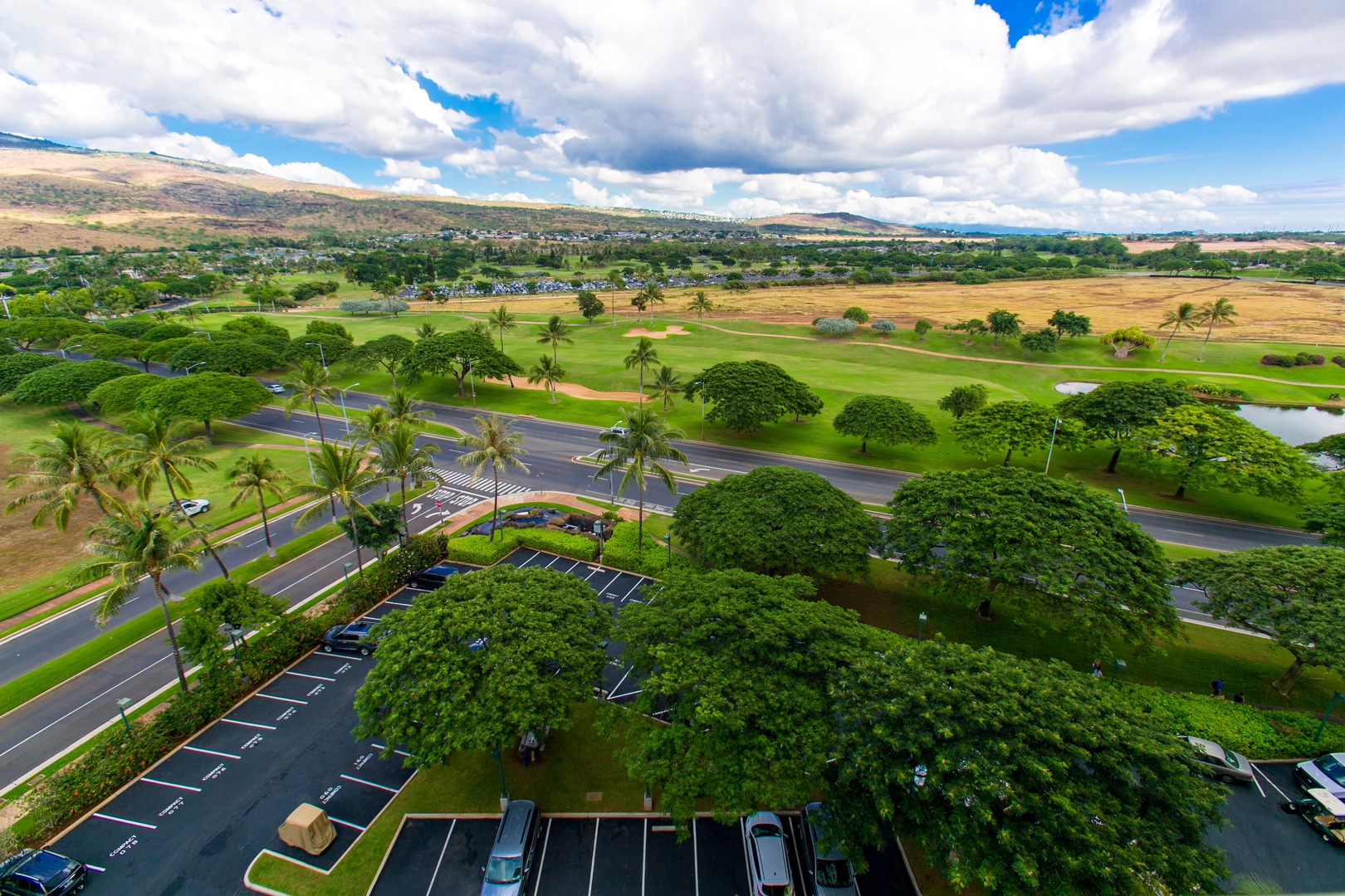 Kapolei Vacation Rentals, Ko Olina Beach Villas O1001 - Golf course and mountain view from the primary bedroom.