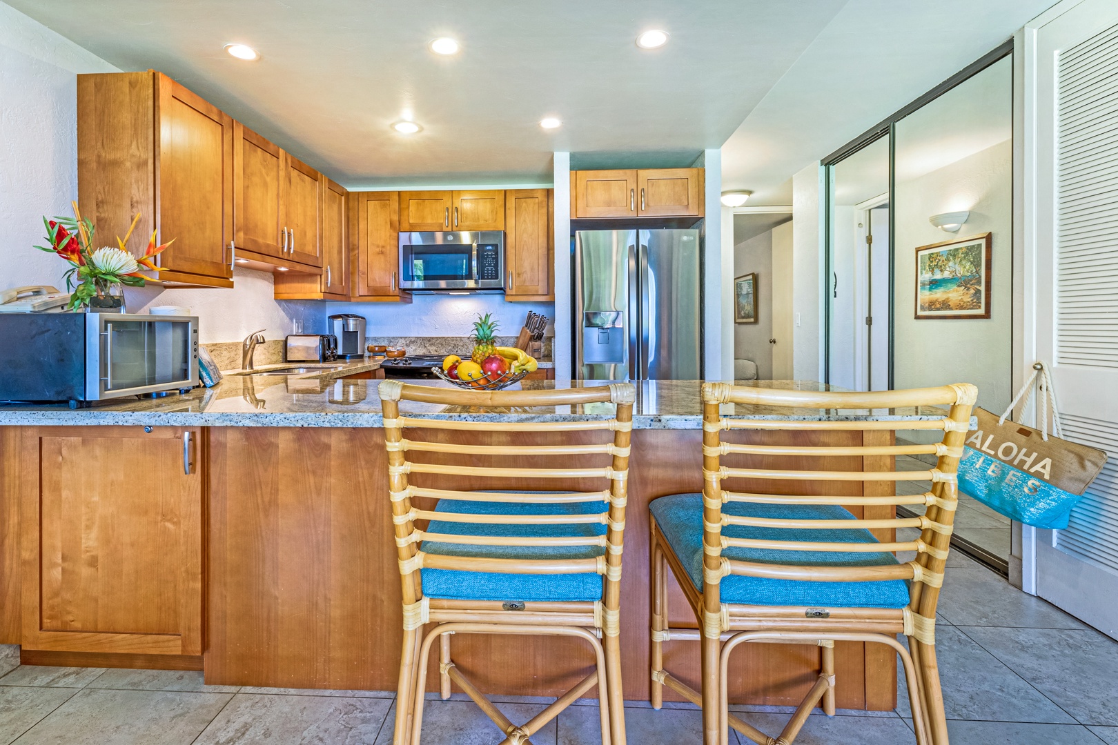 Lahaina Vacation Rentals, Papakea K-105 - The kitchen's breakfast bar offers additional seating for casual dining