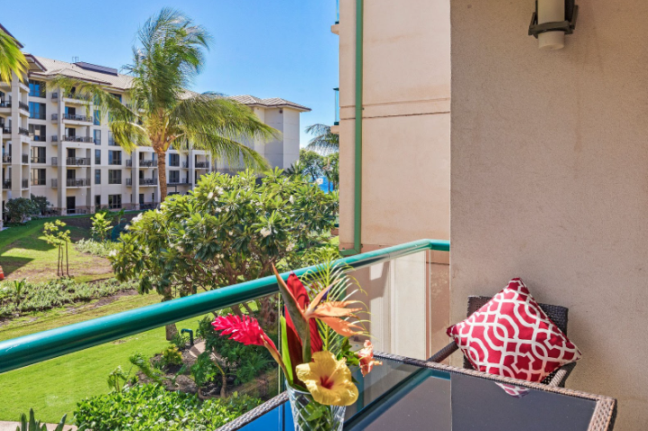 Lahaina Vacation Rentals, Honua Kai Hokulani 214 - Enjoy a relaxing moment on the private lanai, with views of the lush greenery and resort surroundings, perfect for morning coffee or evening drinks.