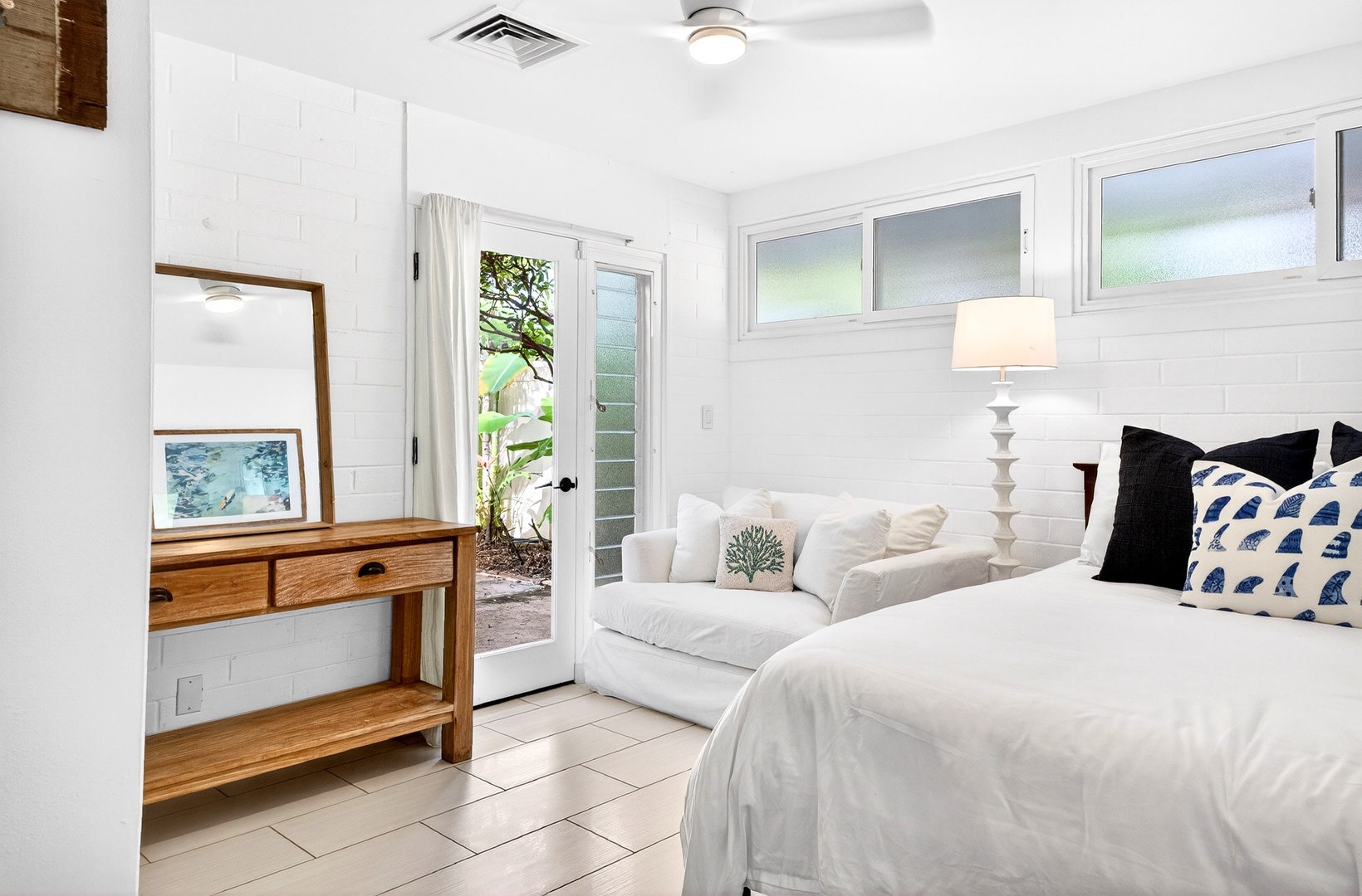 Kailua Vacation Rentals, Hale Ohana - Drift into peaceful sleep in your bright, airy bedroom with crisp white linens and a cozy reading nook by the garden door.