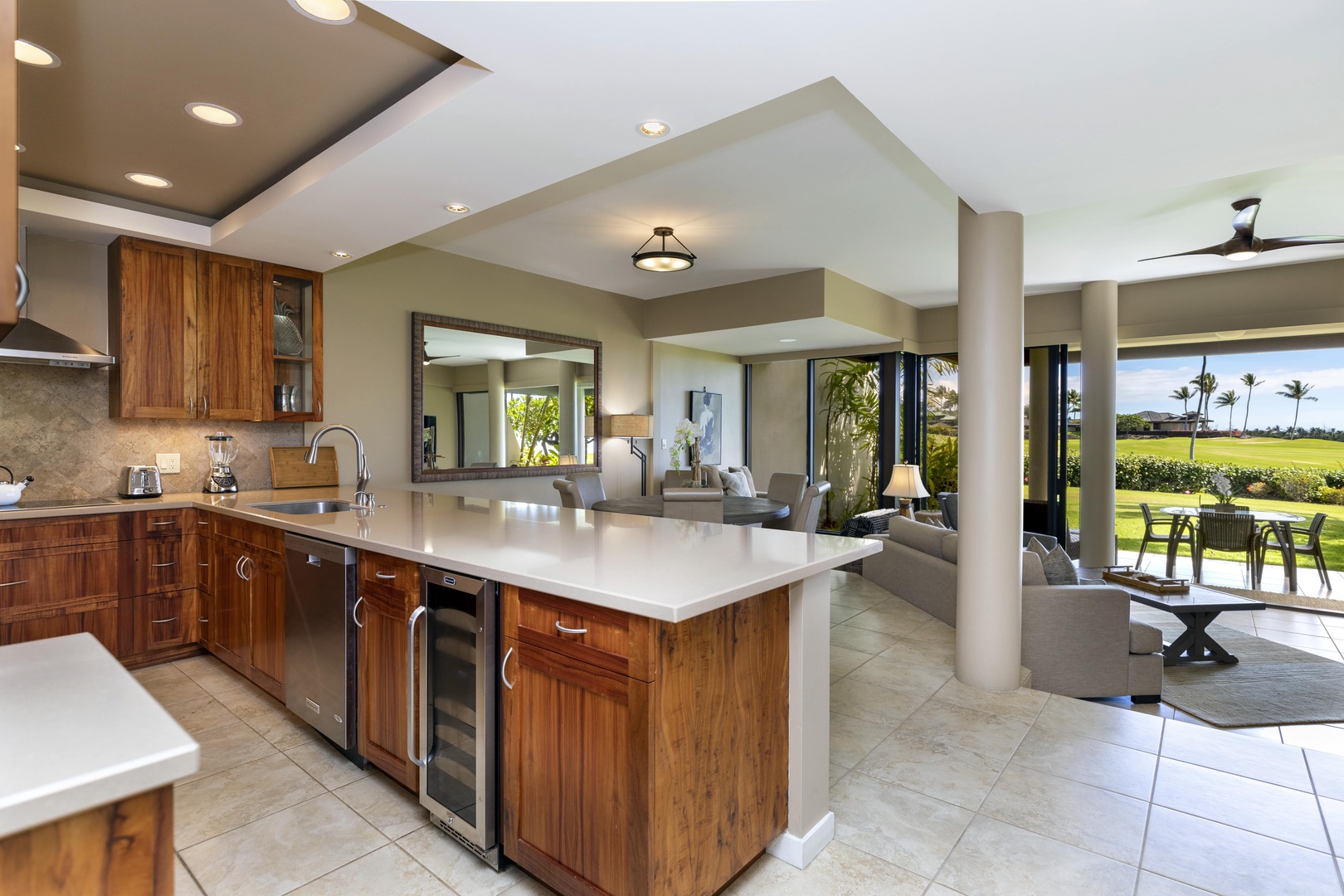 Kamuela Vacation Rentals, Mauna Lani Point E105 - This open-concept kitchen features sleek countertops, custom cabinetry—perfect for effortless entertaining and casual island living.