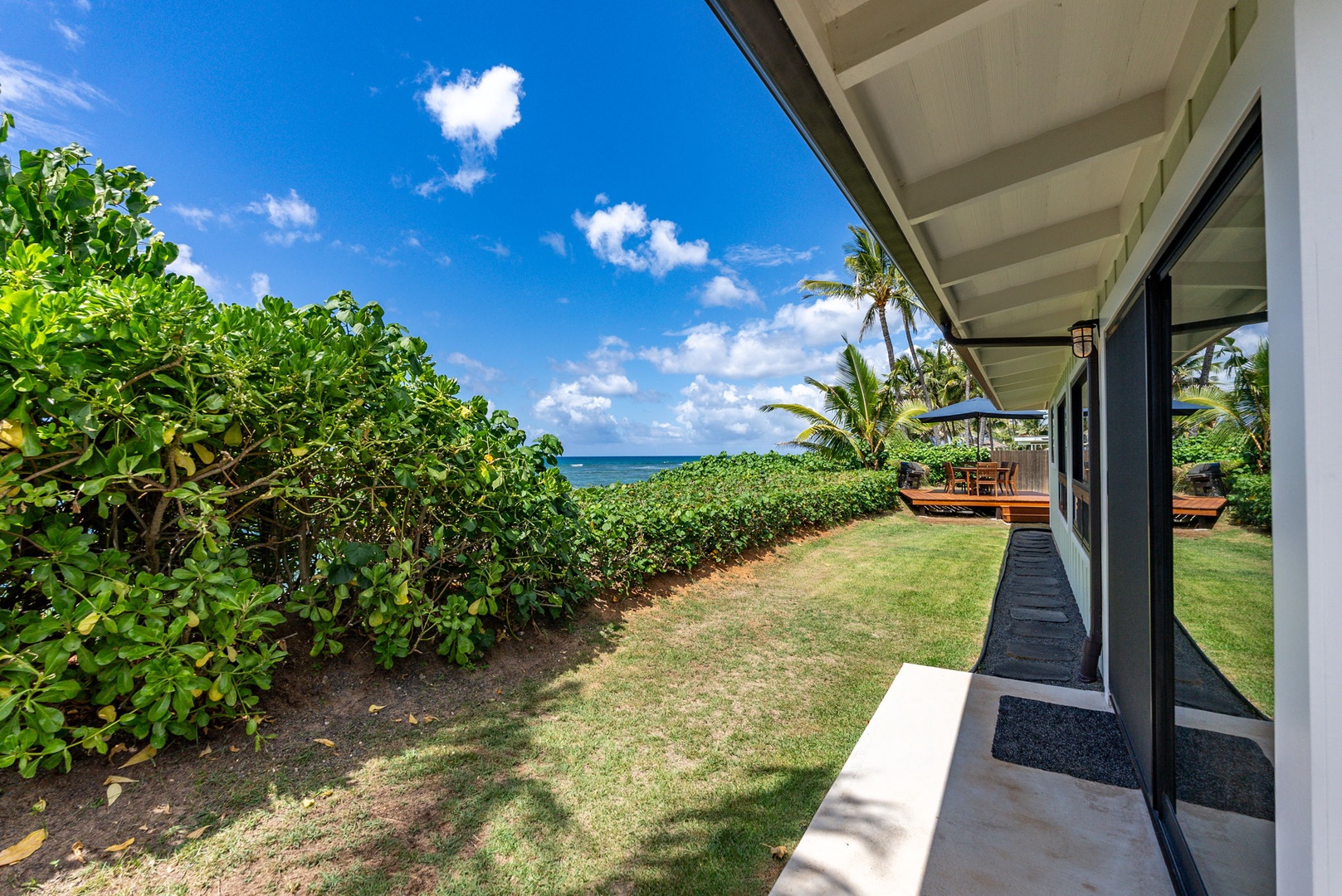 Waialua Vacation Rentals, Mokuleia Beach Villa** - Savor the panoramic ocean views from your home.