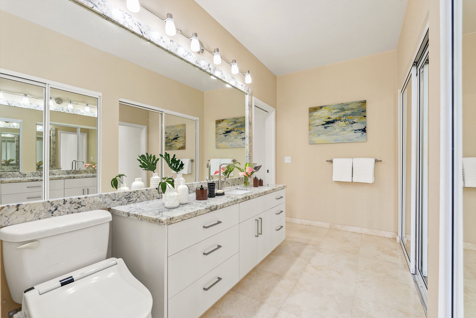 Honolulu Vacation Rentals, Paradise Beach Estate - The primary bathroom features double vanities, ample storage, and sophisticated finishes—your personal spa retreat.