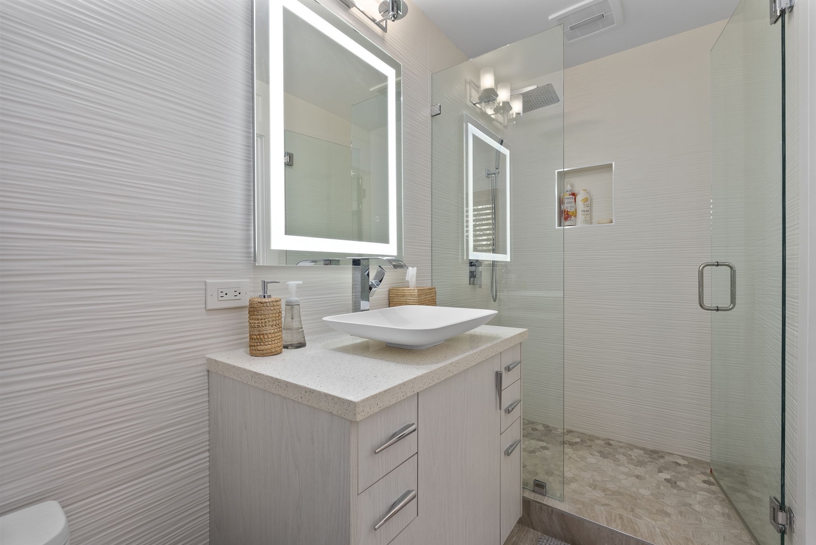 Honolulu Vacation Rentals, Honolulu Lagoonfront Villa - Modern ensuite bath with glass shower and illuminated mirror.