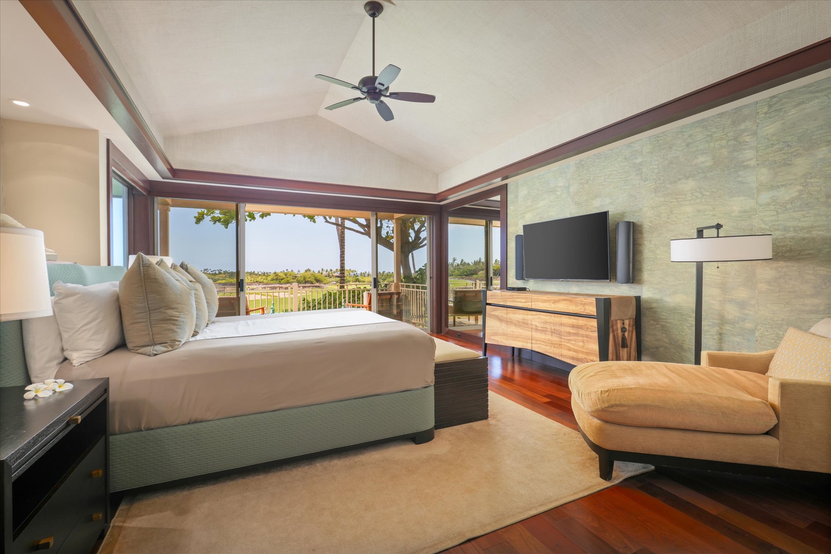 Kailua Kona Vacation Rentals, Wai'ulu Villa 115D - Primary suite with stunning garden and golf course views—sliding doors open to a private lanai with motorized blinds.