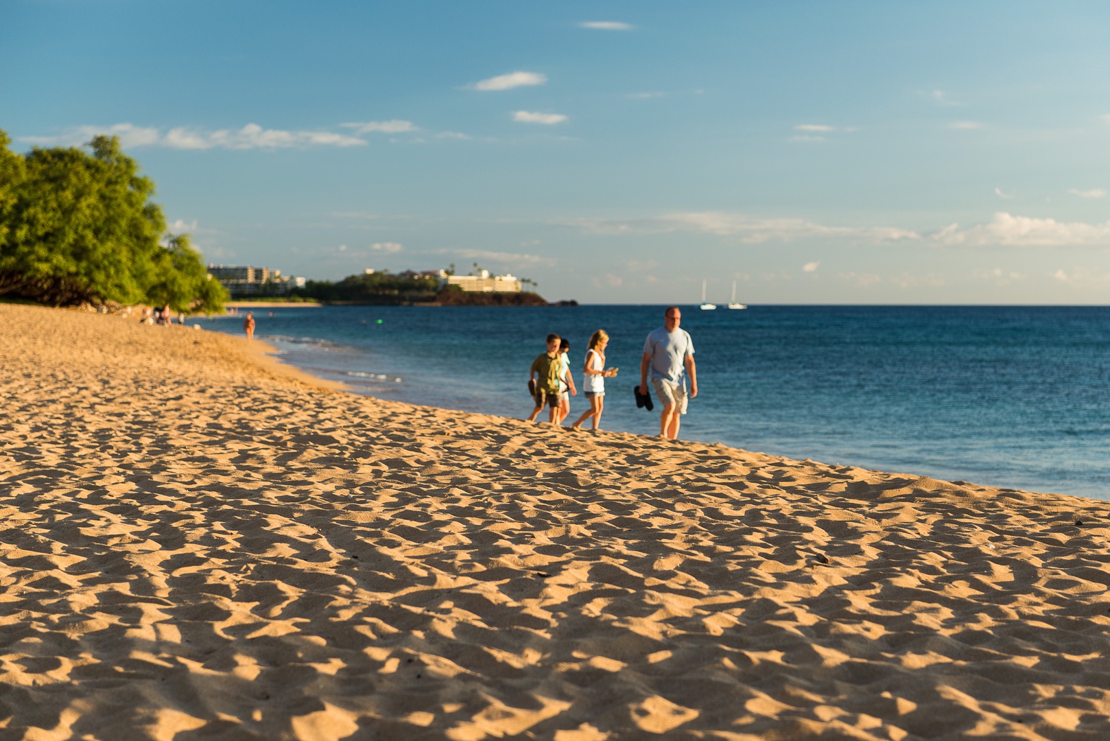 Lahaina Vacation Rentals, Honua Kai Konea 204 - Take a relaxing stroll along the beach as the sun begins to set over the ocean.